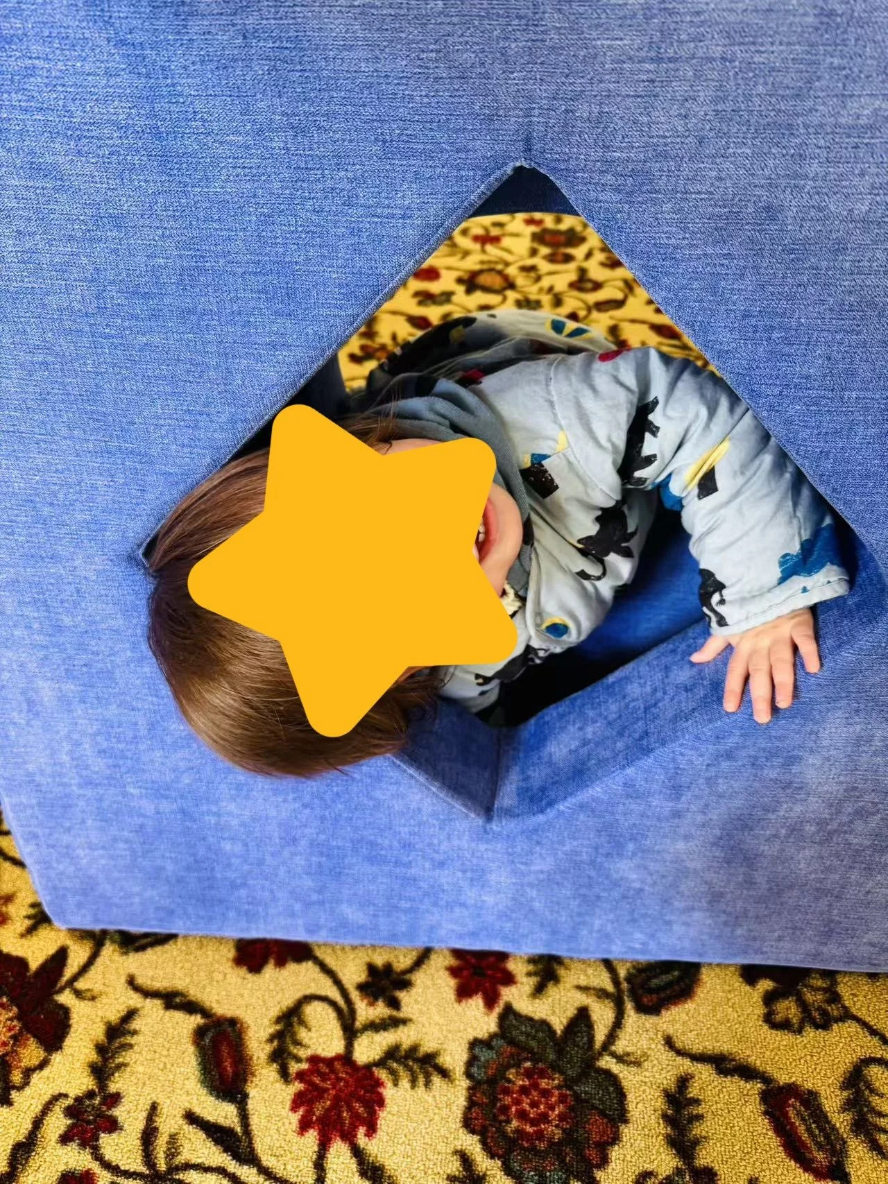 Child exploring a crawling activity at Red Apple Daycare, supporting sensory integration and motor development.
