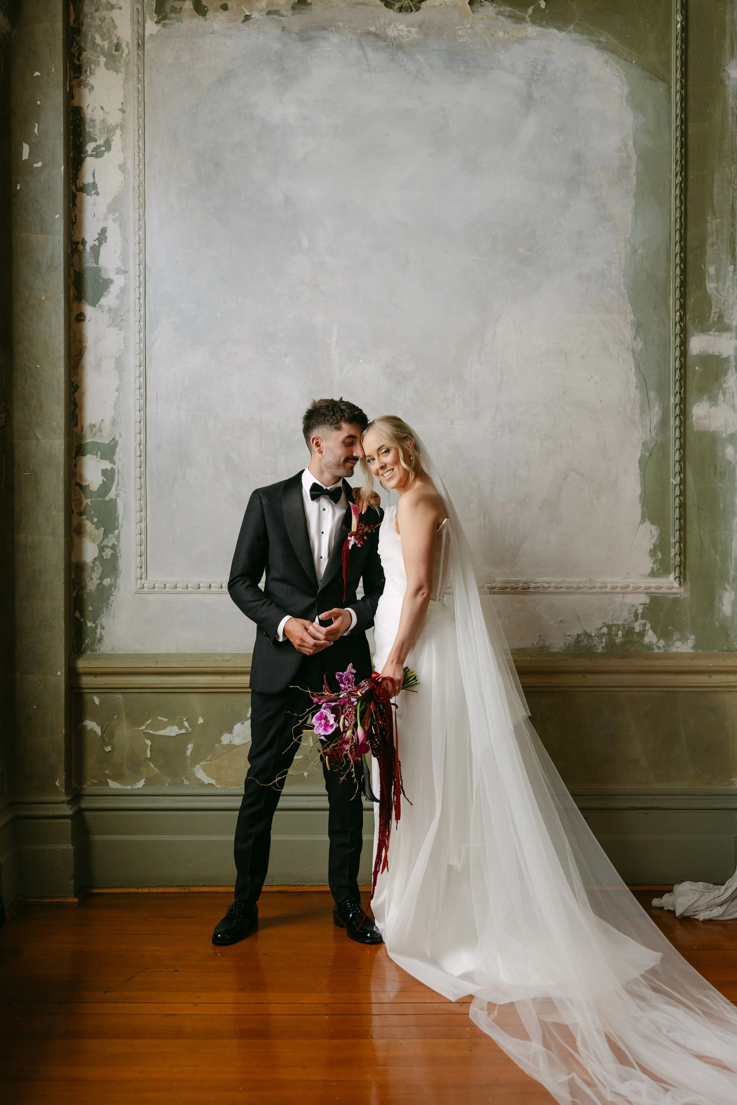 A bride and groom textured heritage wall photoshoot the george ballroom