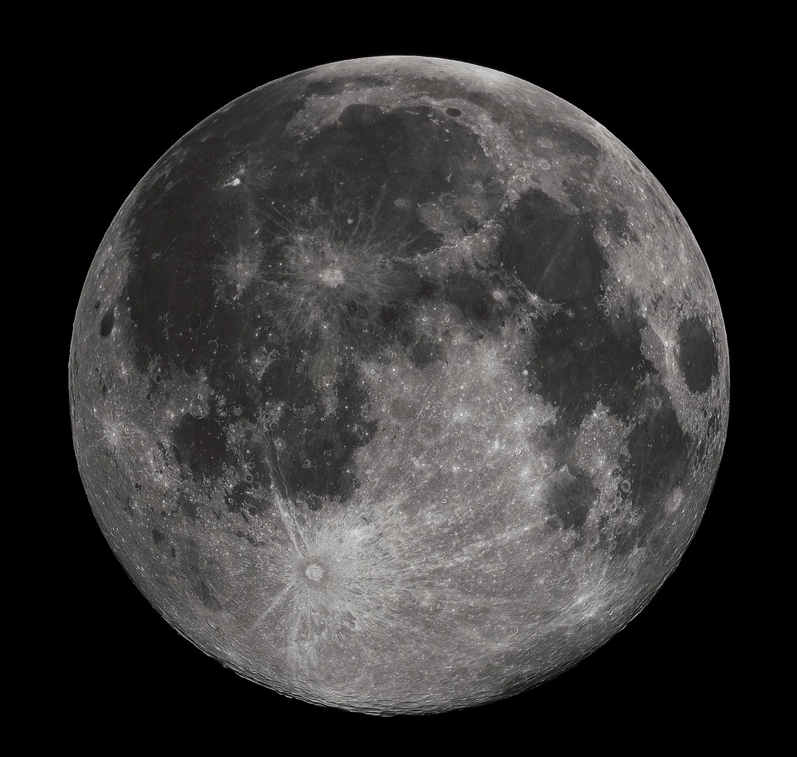 Full moon against a black sky showing detailed craters and surface textures.