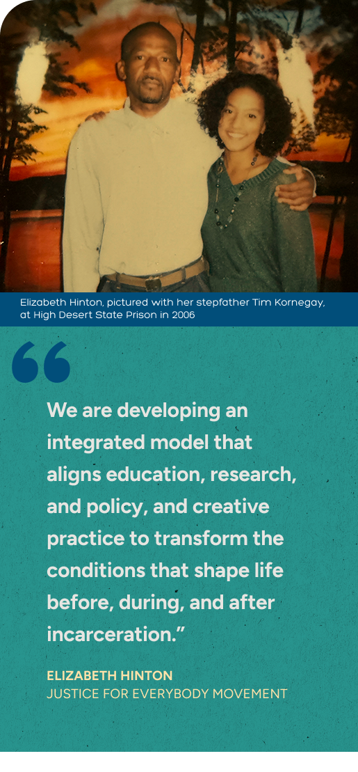 Photograph of Elizabeth Hinton with her stepfather Tim Kornegay at High Desert State Prison in 2006, with a sunset background and trees, one man and one woman smiling, woman with curly hair wearing a sweater, man with short hair in a light shirt.