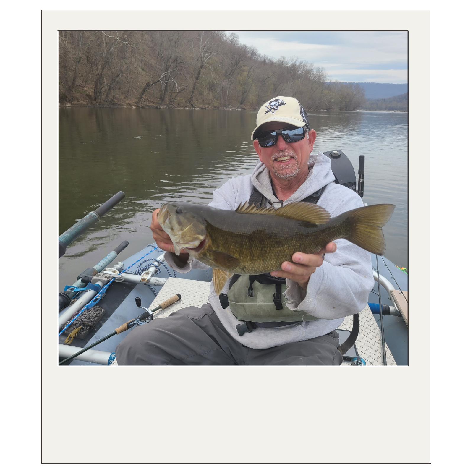 Bryan Kelly holding a trophy smallmouth bass on a guided fly-fishing trip near Harpers Ferry, West Virginia with White Fly Outfitters.