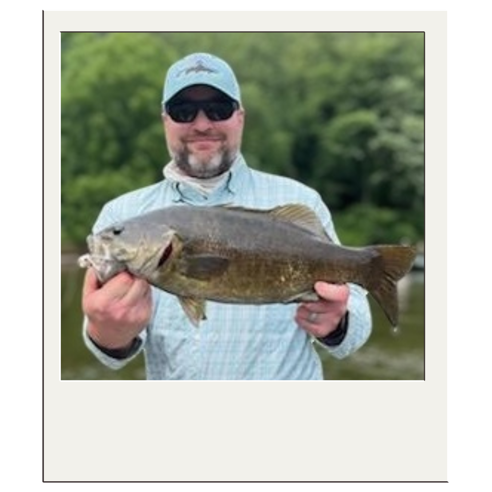 Client showing off a catch from a guided float trip on the Potomac River near Harpers Ferry, WV.