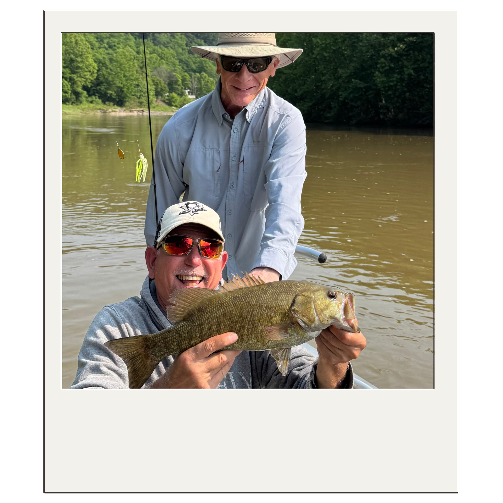 Bryan and client holding a smallmouth bass on a guided fly-fishing trip near Harpers Ferry, WV.