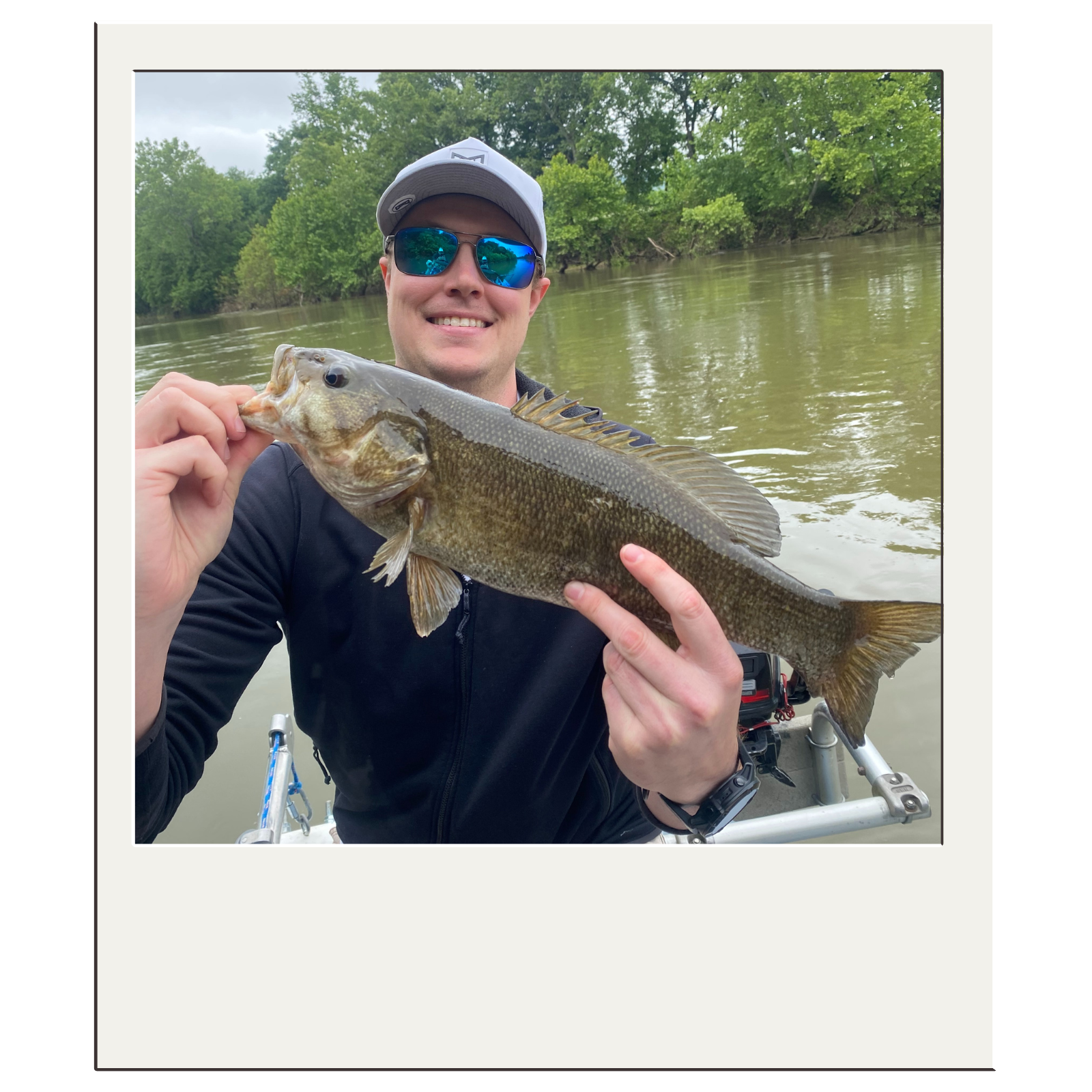 Fly angler proudly displaying bass caught during a guided float trip near Harpers Ferry.