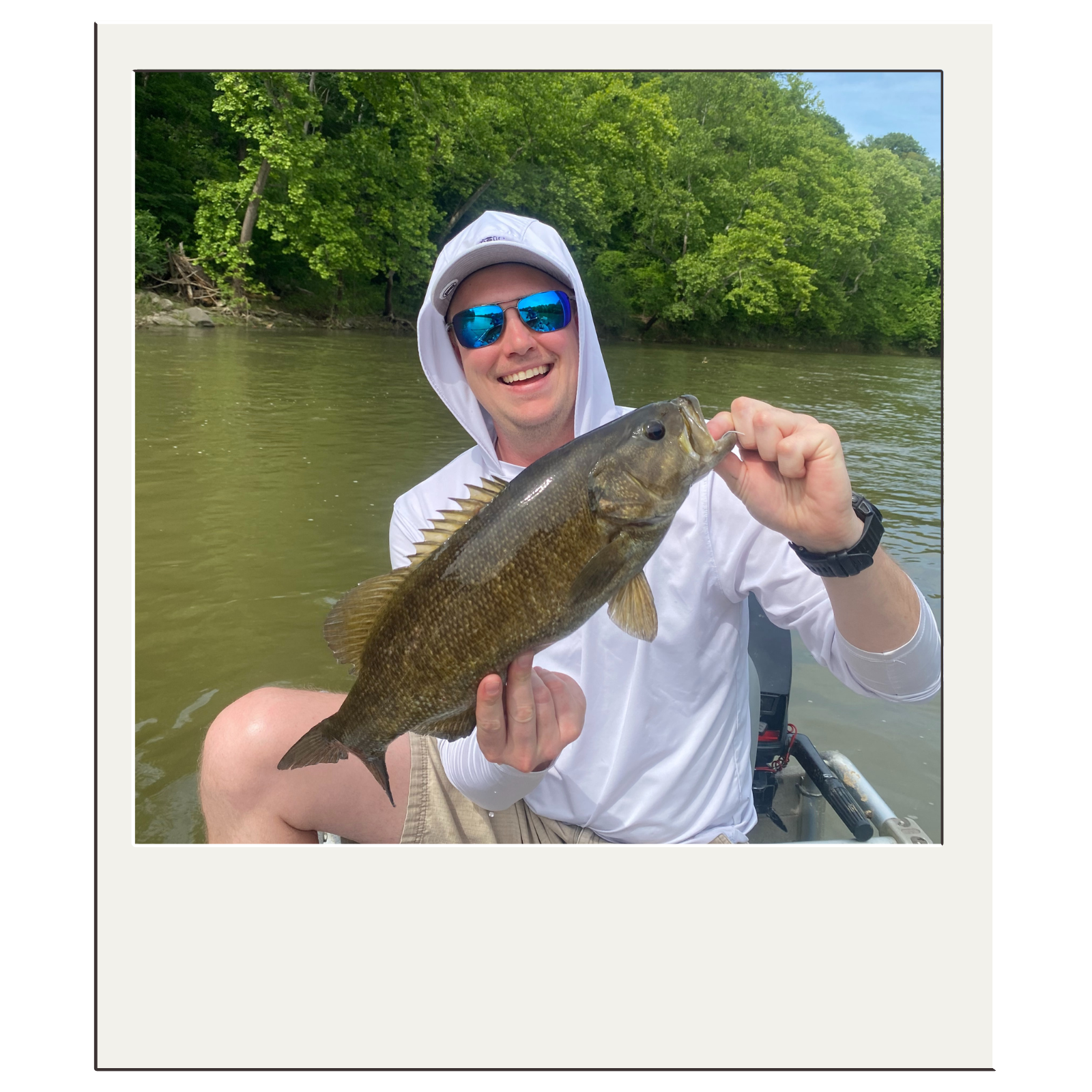 Client showing off a smallmouth bass caught on fly with White Fly Outfitters near Harpers Ferry.