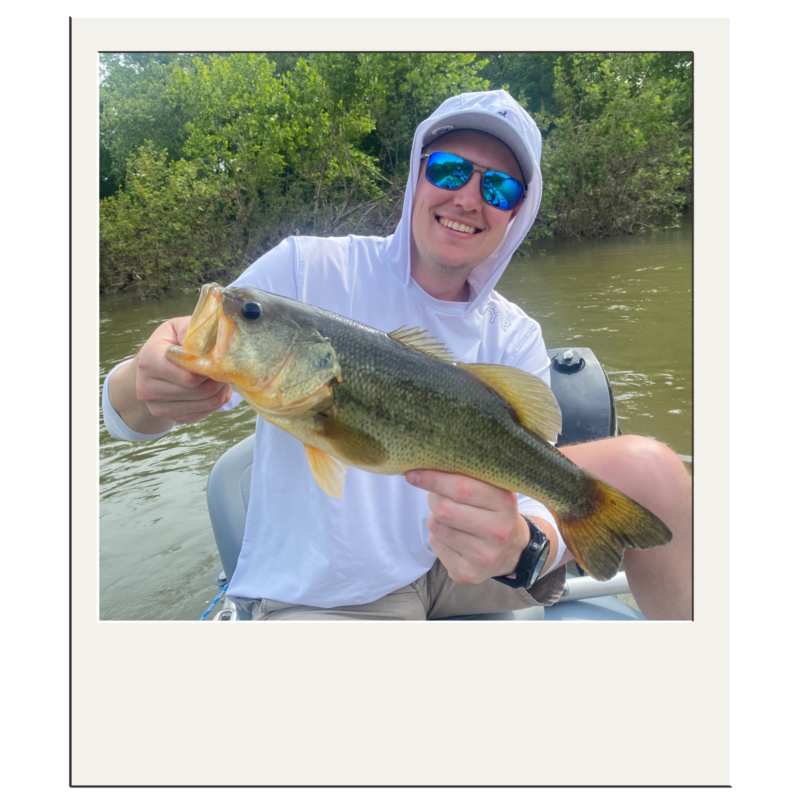 Angler holding a smallmouth bass during a guided Potomac River fishing trip.