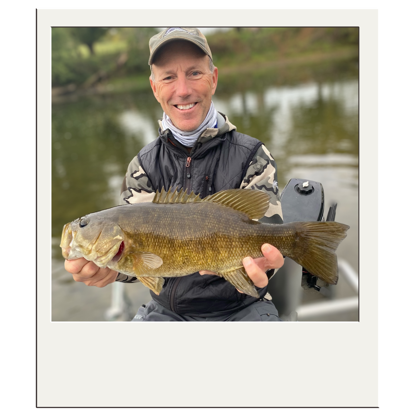 Happy fly-fishing client showing a large smallmouth bass caught near Harpers Ferry, WV.
