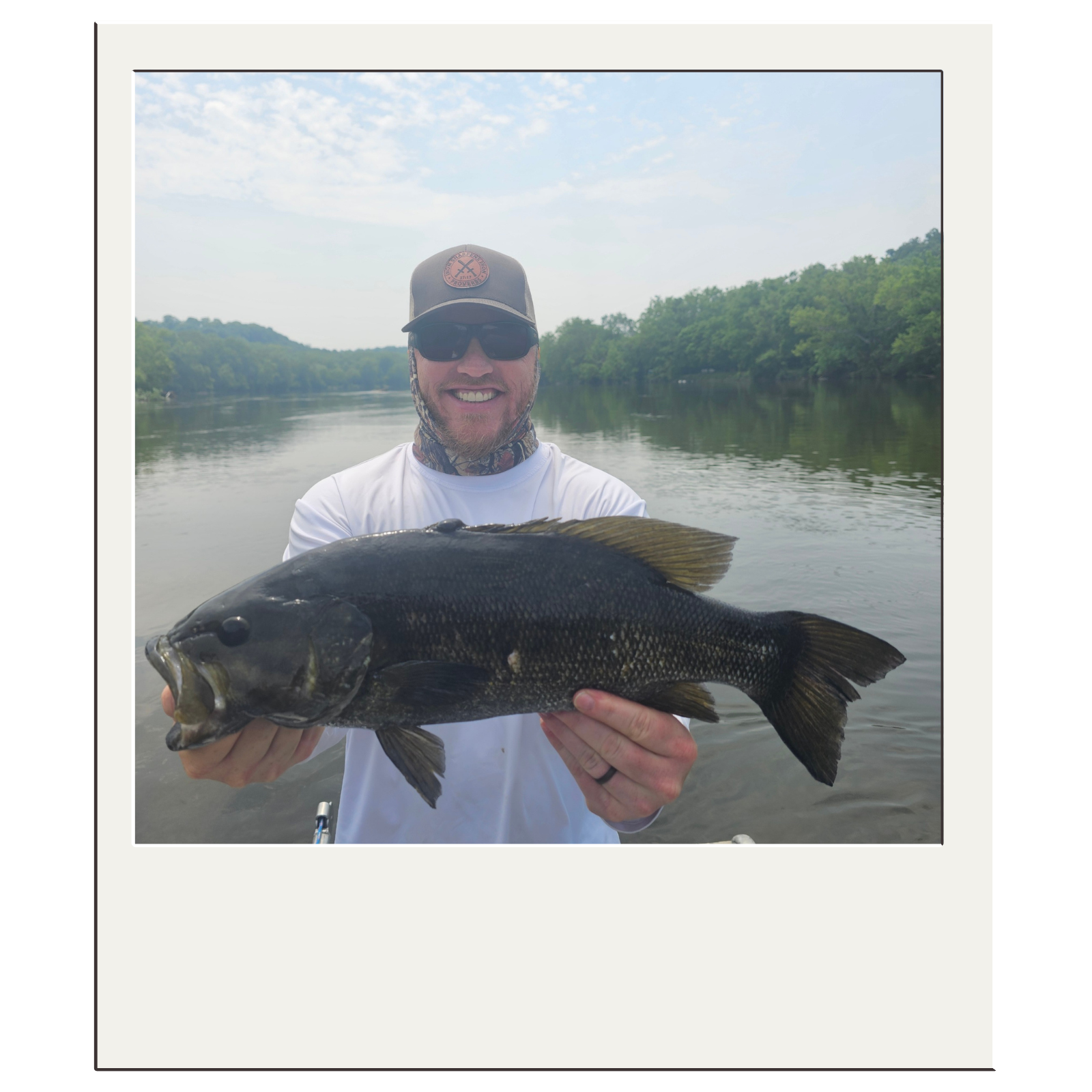 West Virginia guided fly-fishing adventure showcasing a successful bass catch near Harpers Ferry.