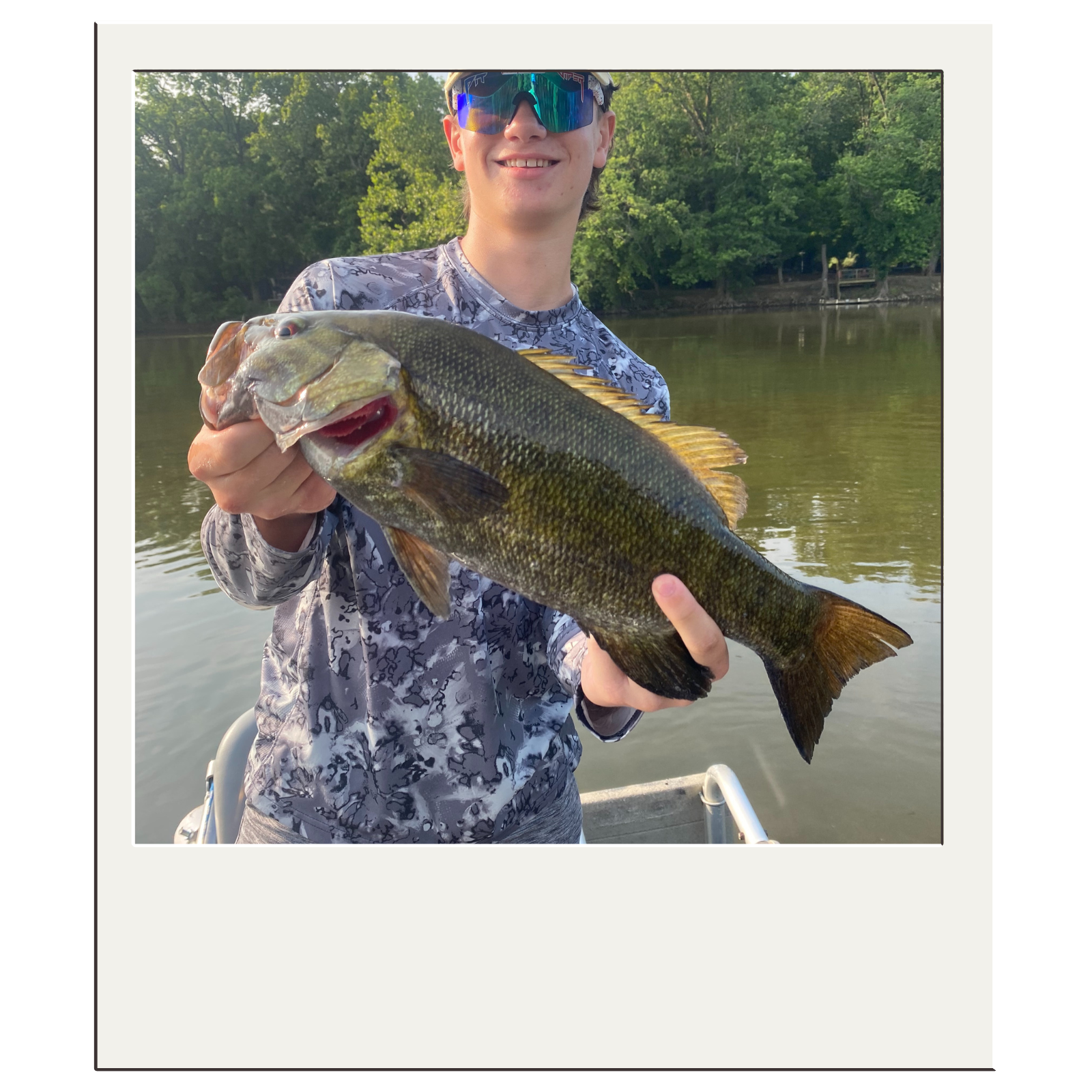 Fisherman displaying a healthy smallmouth bass caught near Harpers Ferry, WV.