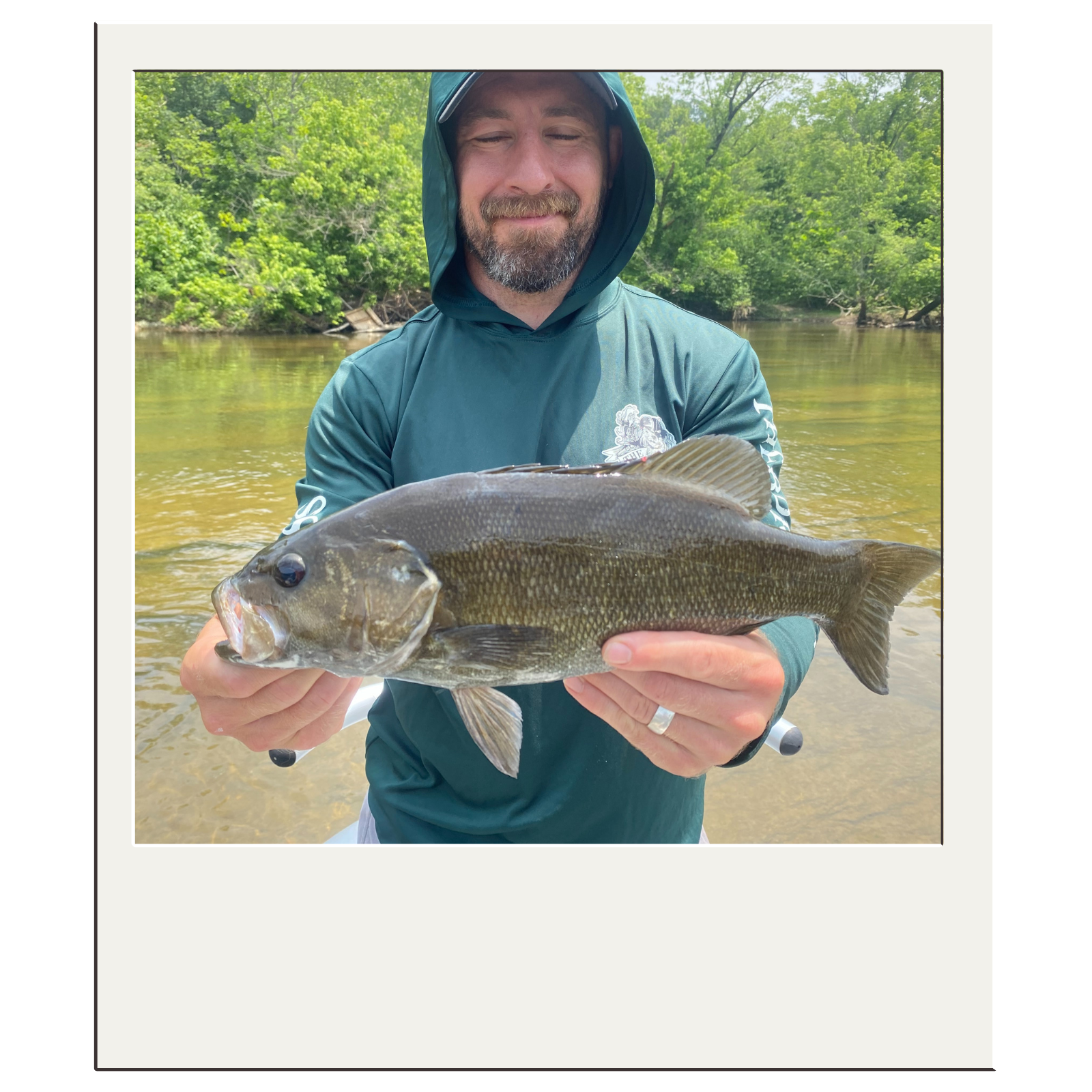 Client showing off a large smallmouth bass on a guided outing with White Fly Outfitters.