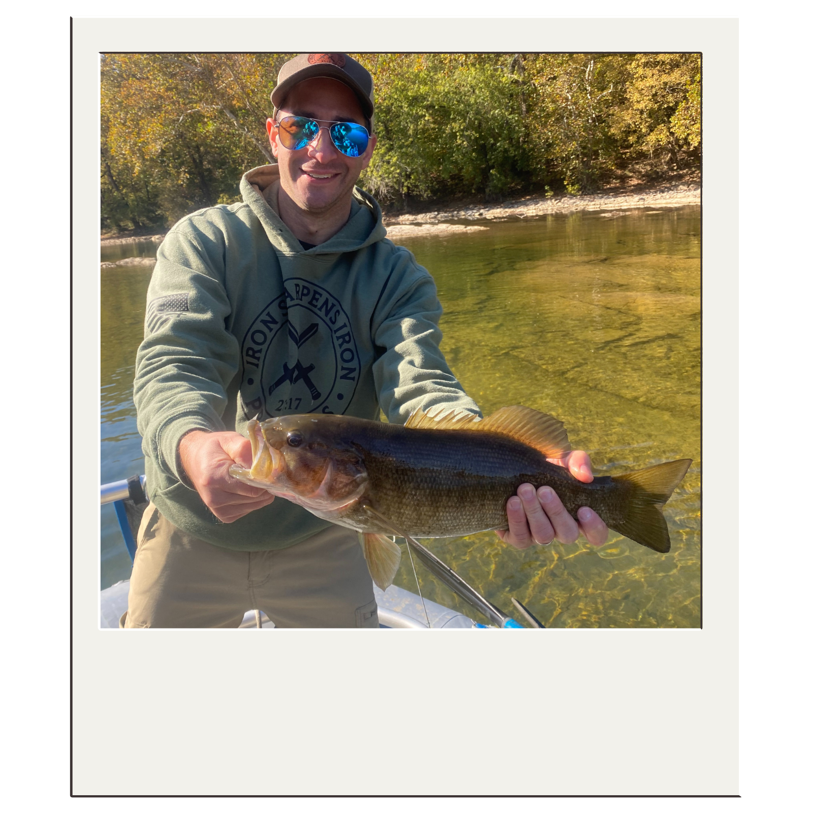 Client proudly displaying a smallmouth bass from a guided outing in the northeast panhandle of West Virginia.