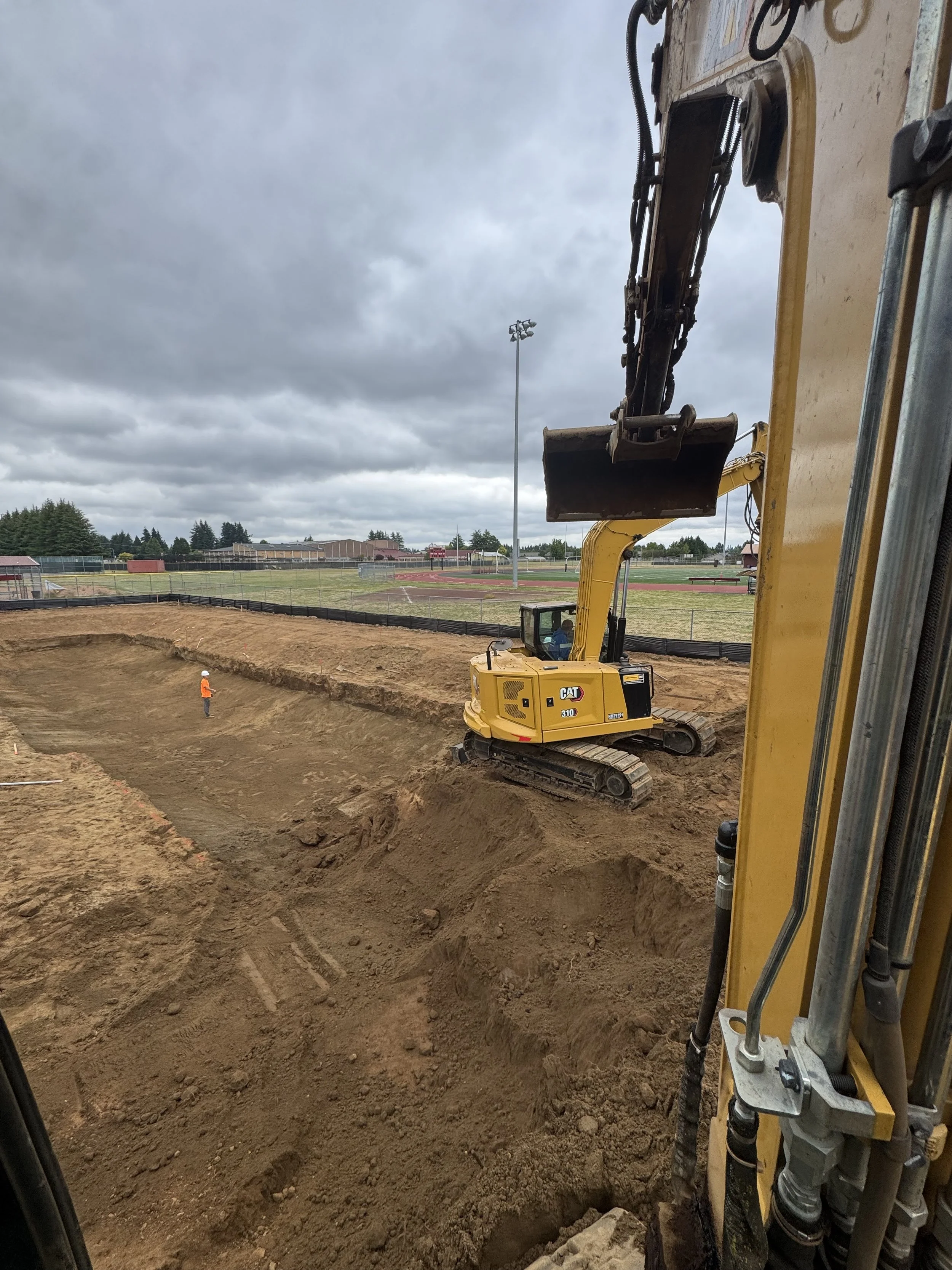 excavation and site development, underground utilities, moving dirt, and foundation digits