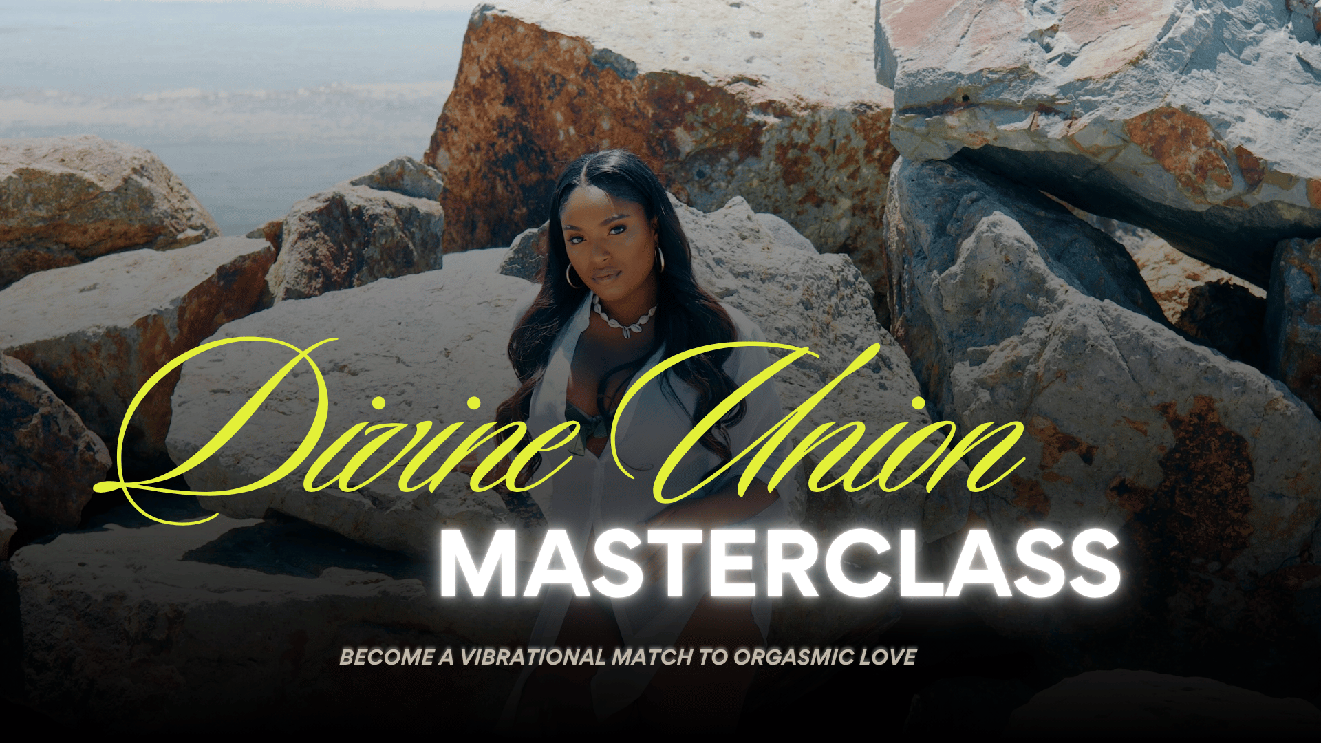 A woman with long dark hair posing among large rocks near the ocean, with the text 'Divine Union Masterclass' and 'Become a vibrational match to orgasmic love' overlaid.