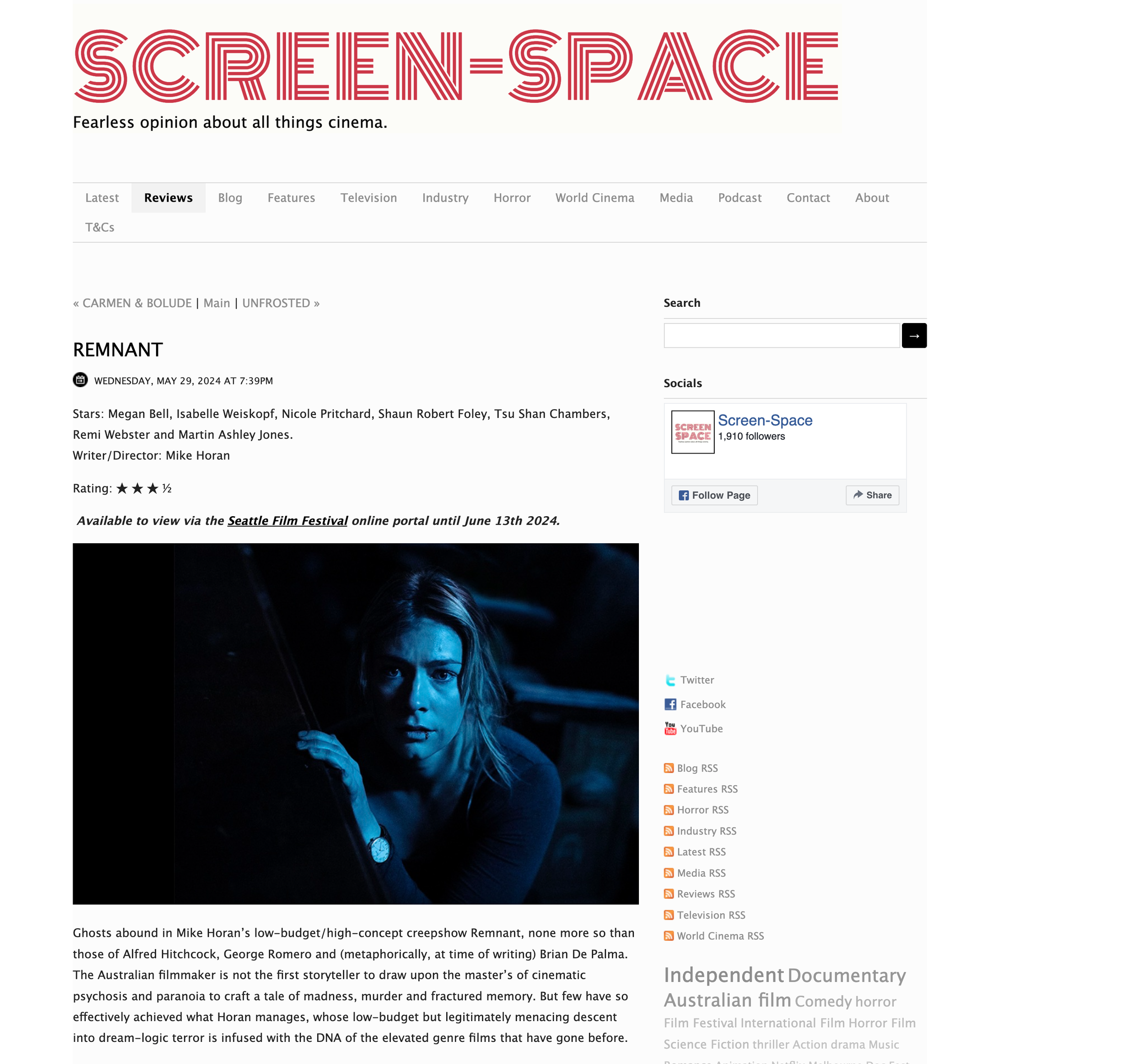 A webpage from Screen Space reviewing a film titled Remnant. The webpage includes the film's credits, rating, availability at the Seattle Film Festival, and a promotional image of a woman with long hair illuminated in blue light.