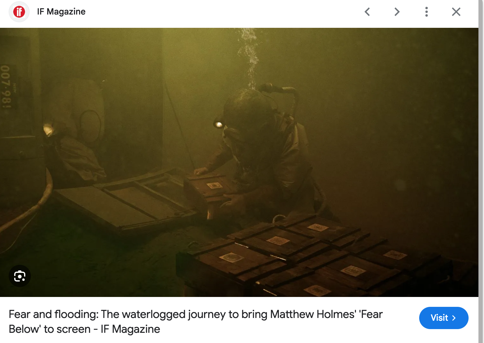 A person in protective gear and a helmet underwater, handling boxes, surrounded by debris and murky water, possibly in the aftermath of flooding.