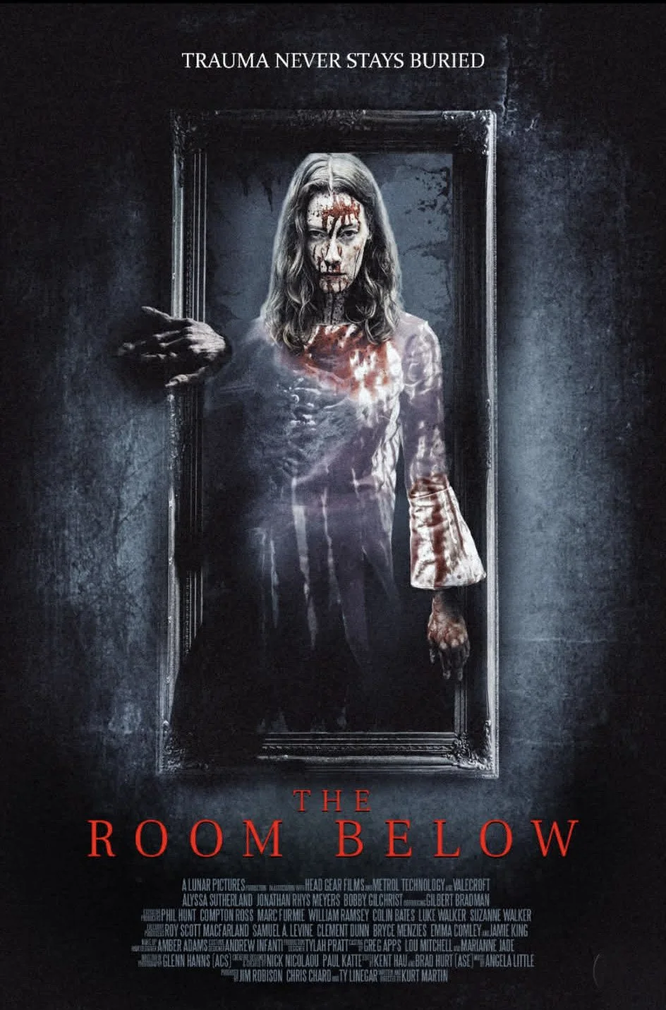 A horror movie poster for 'The Room Below' featuring a woman with blood on her face and clothing, standing in a dark room, with the tagline "Trauma Never Stays Buried" at the top.