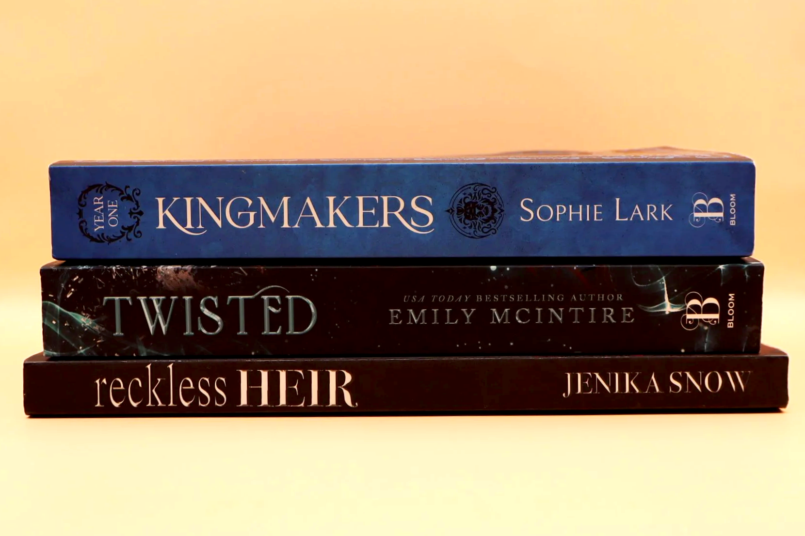 Book stack, King Makers by Sophie Lark, Twisted by Emily McIntire, Reckless Heir by Jenika Snow
