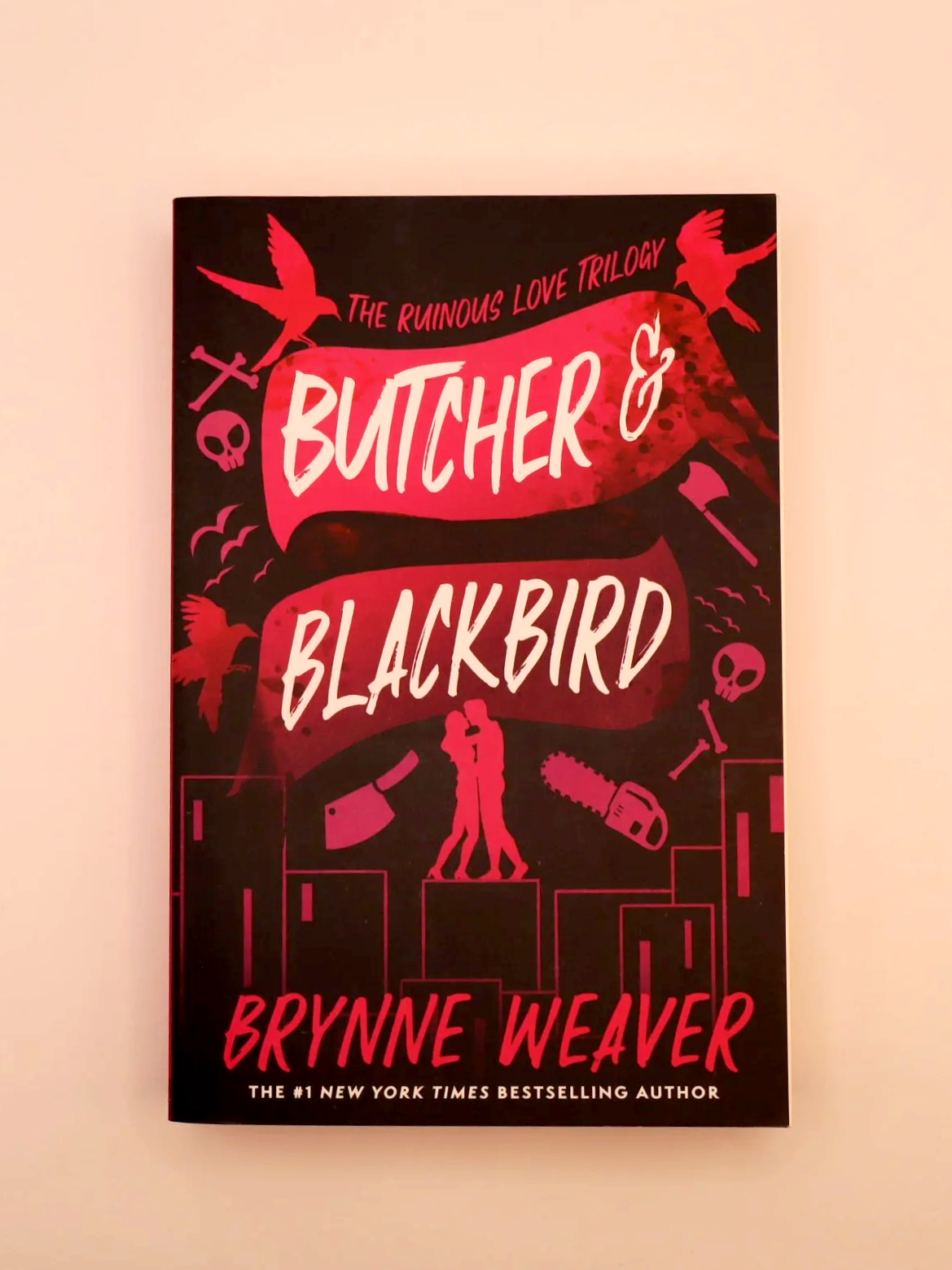 Dark romance cover for Butcher & Blackbird by Brynne Weaver featuring red and black illustrated elements.