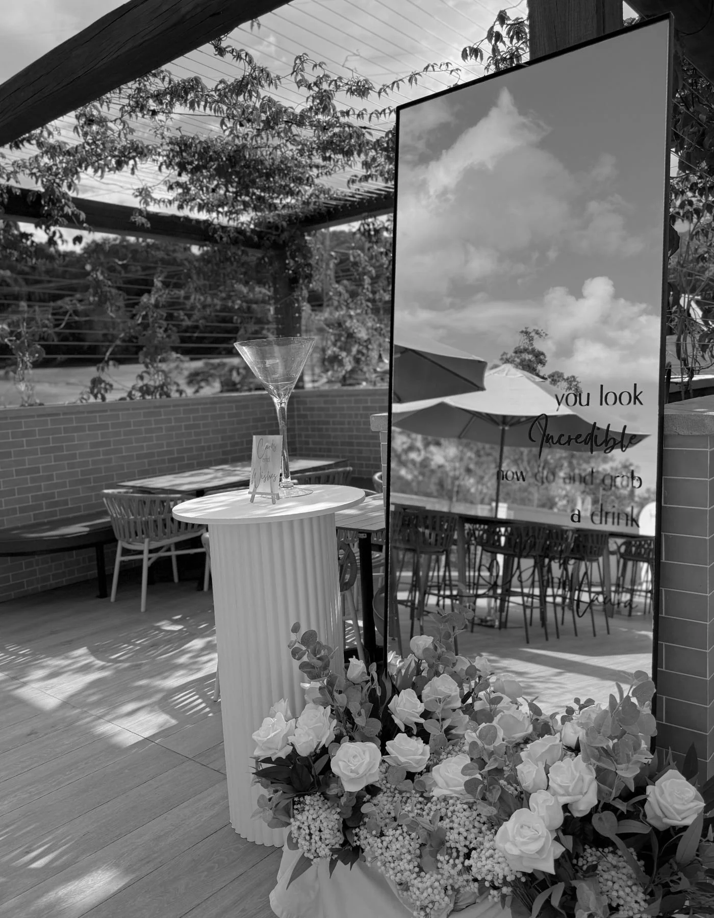 Elegant event floral styling with white blooms and greenery at a Gold Coast celebration by Saudade Events.