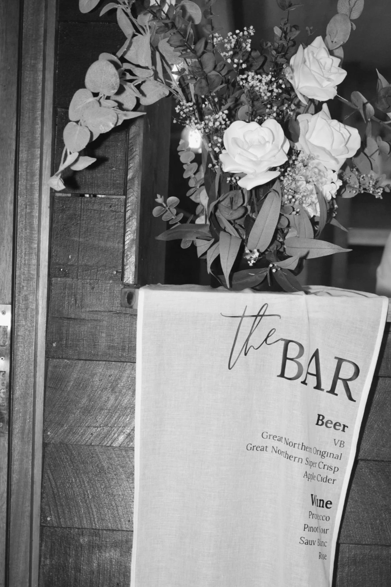 Wedding bar signage with floral styling at Gold Coast reception