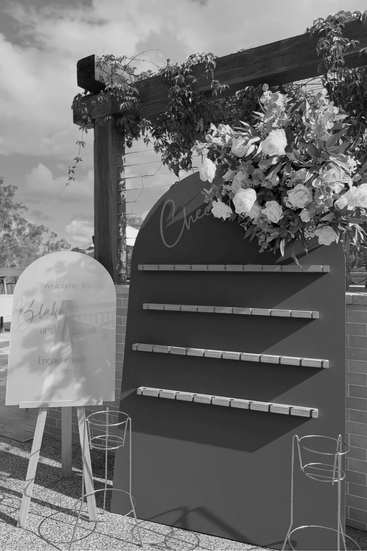 Engagement backdrop styling with champagne wall at Tallai Golf Club