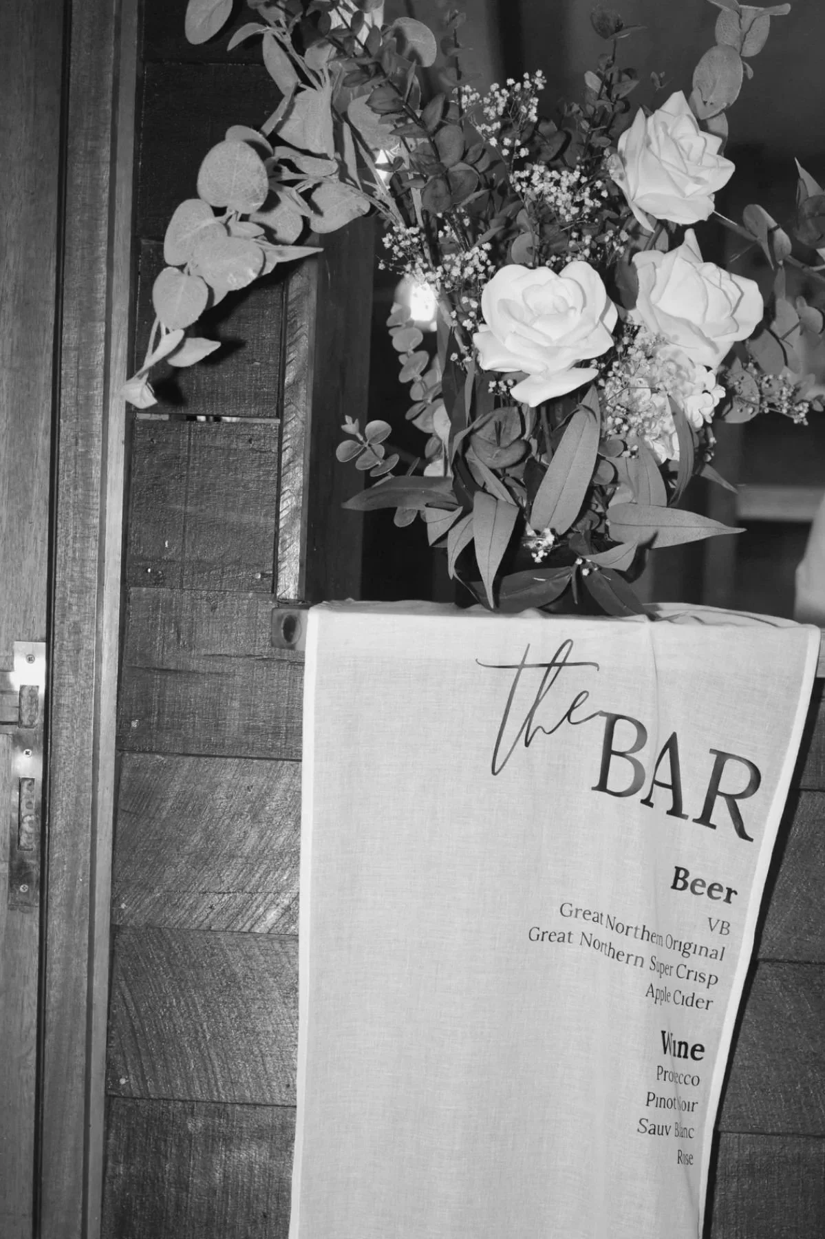 Wedding bar signage with floral styling at Gold Coast reception