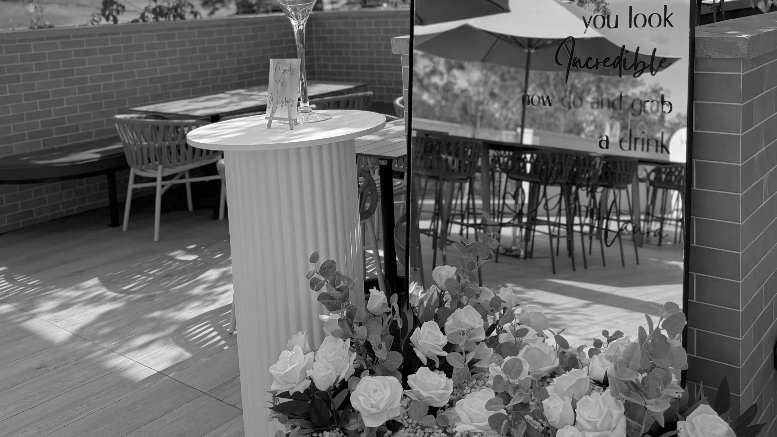Elegant Gold Coast celebration styling with custom signage, florals and modern event décor by Saudade Events.