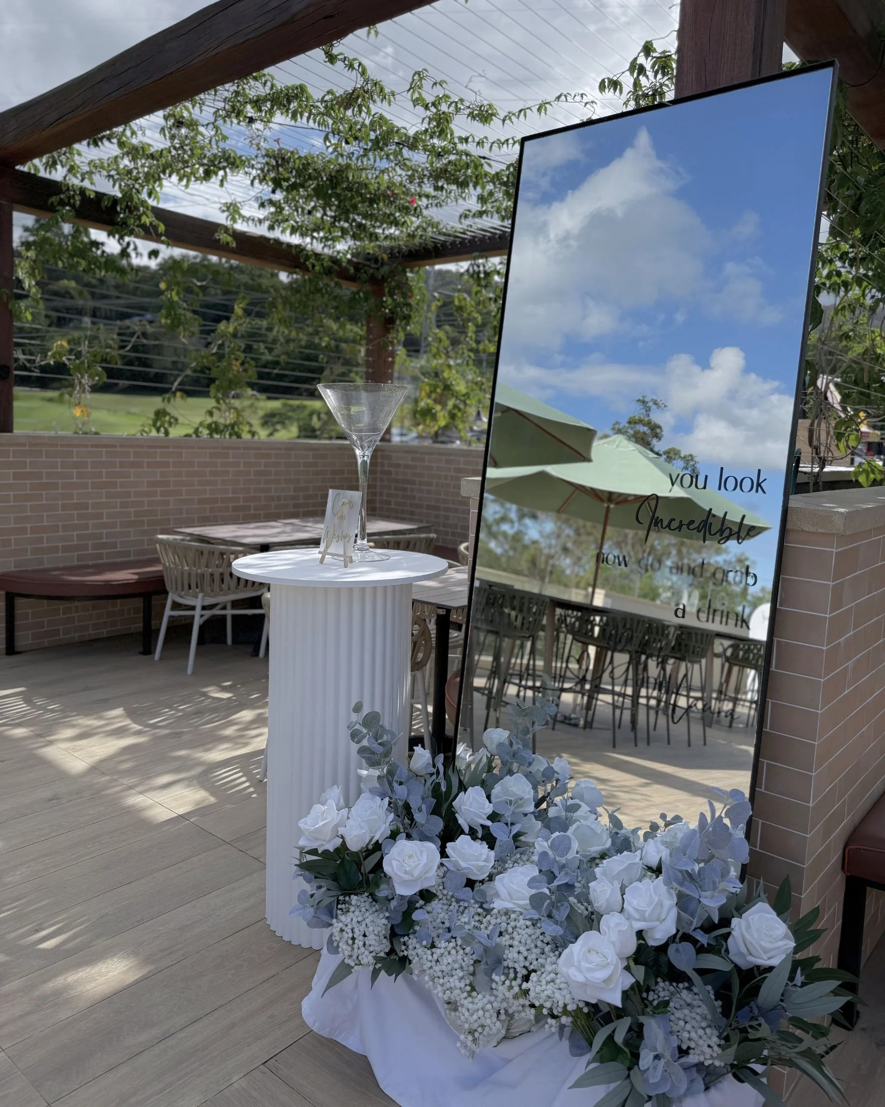 Engagement party mirror signage styling at Tallai Golf Club on the Gold Coast.