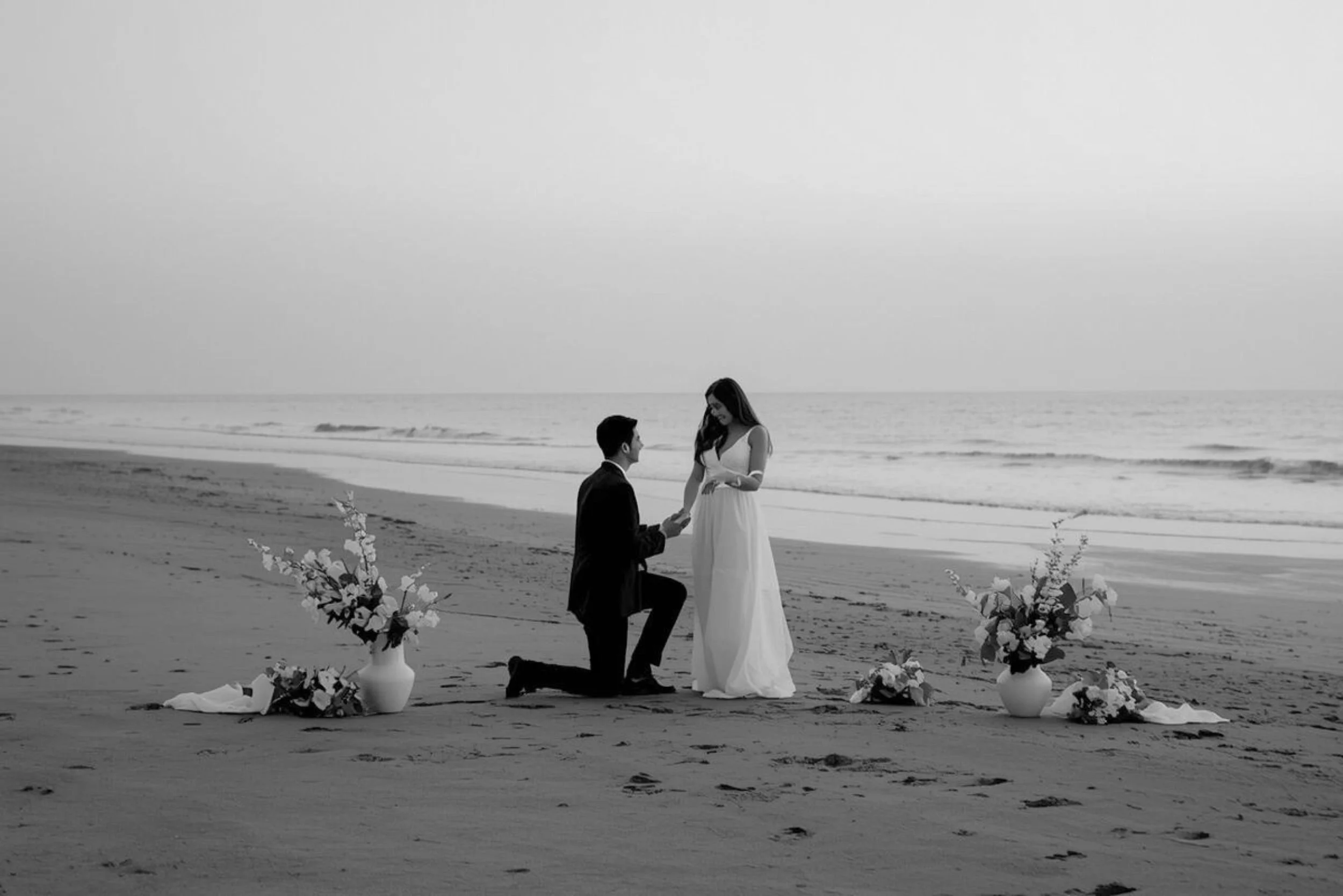 Romantic Gold Coast beach proposal styling with florals and candles designed by Saudade Events.