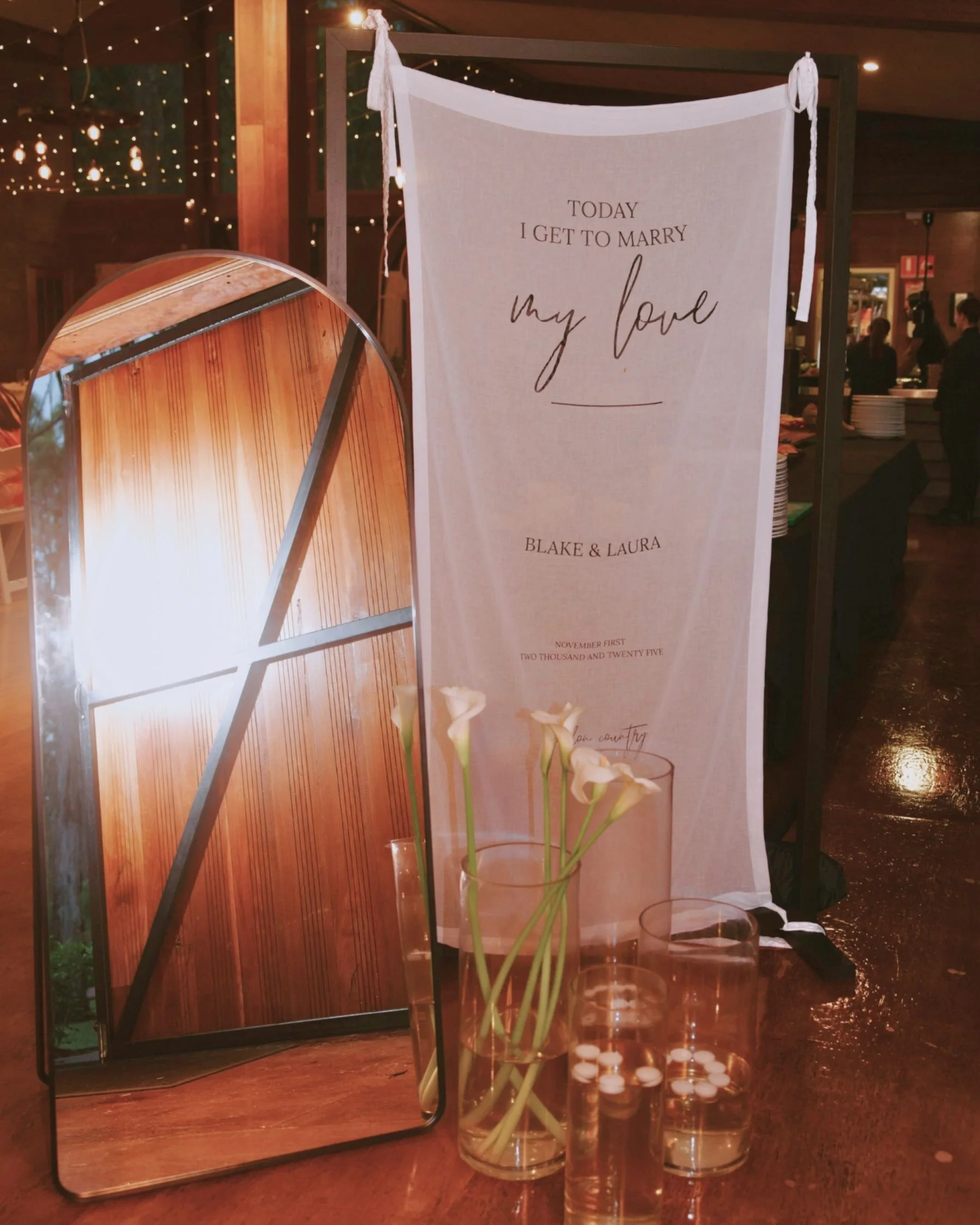 Wedding fabric signage and mirror welcome display styled in Gold Coast by Saudade Events.
