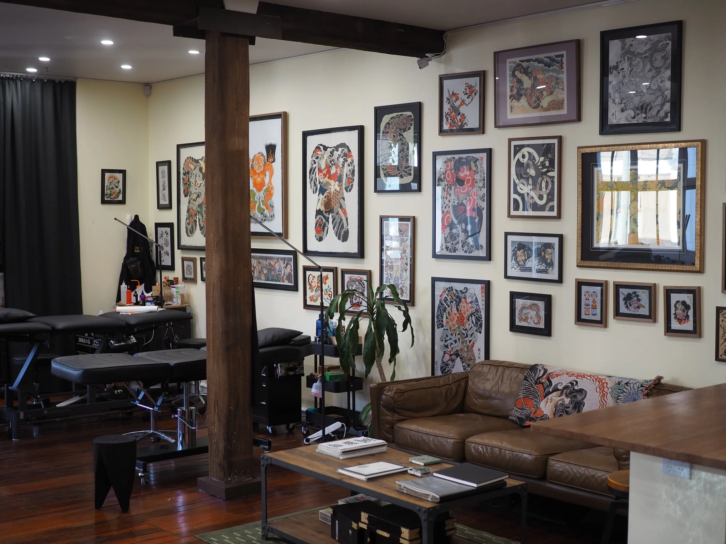 tattoo studio with flash and art on the walls