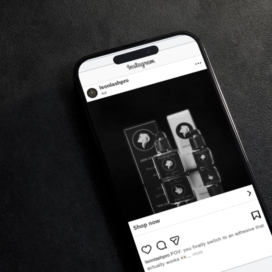 A smartphone displaying an Instagram ad for skincare products with a lion logo, placed on a black surface.