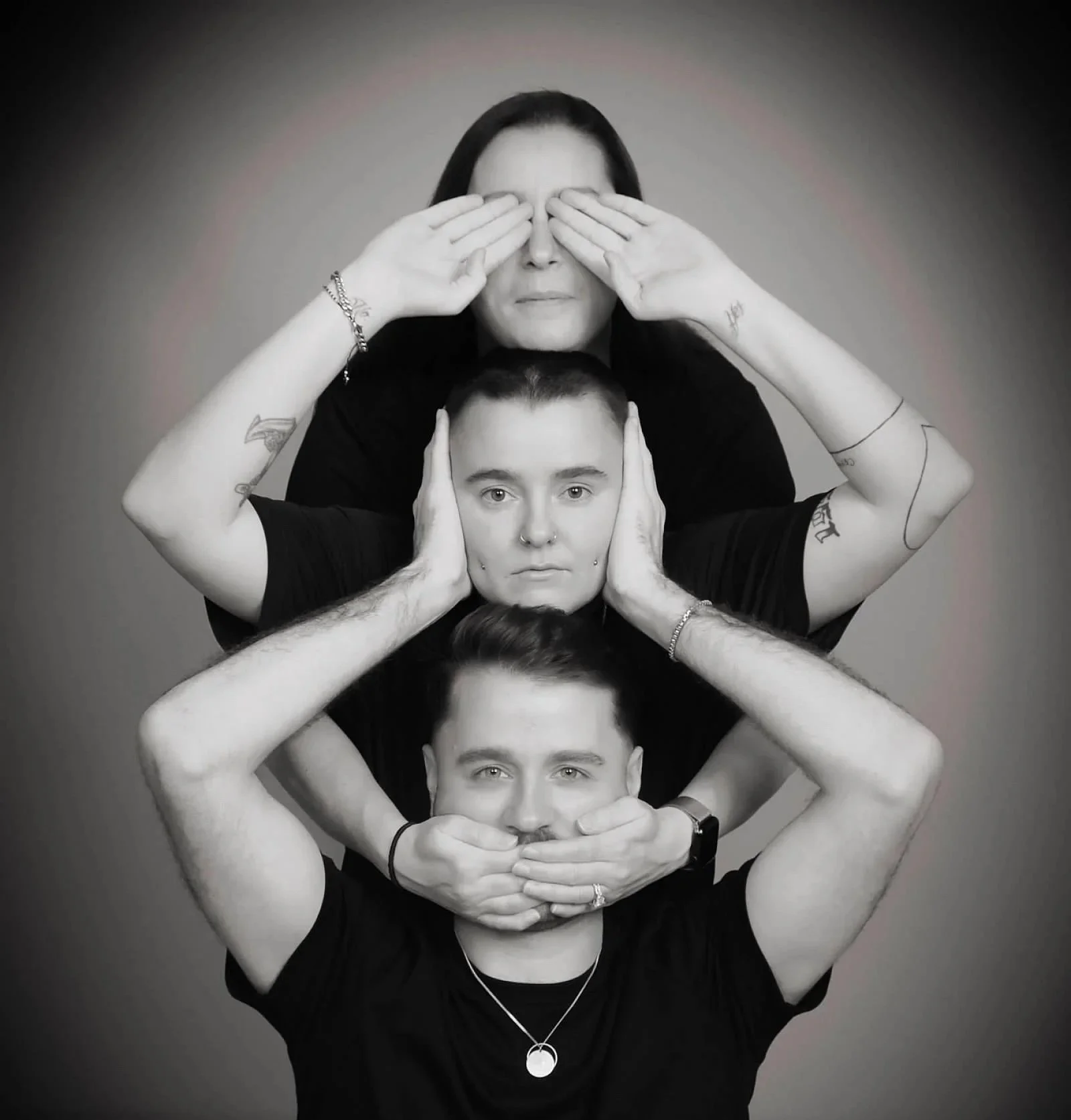 Three people stacked vertically, each covering their eyes or mouth with their hands, creating a layered portrait against a plain background.