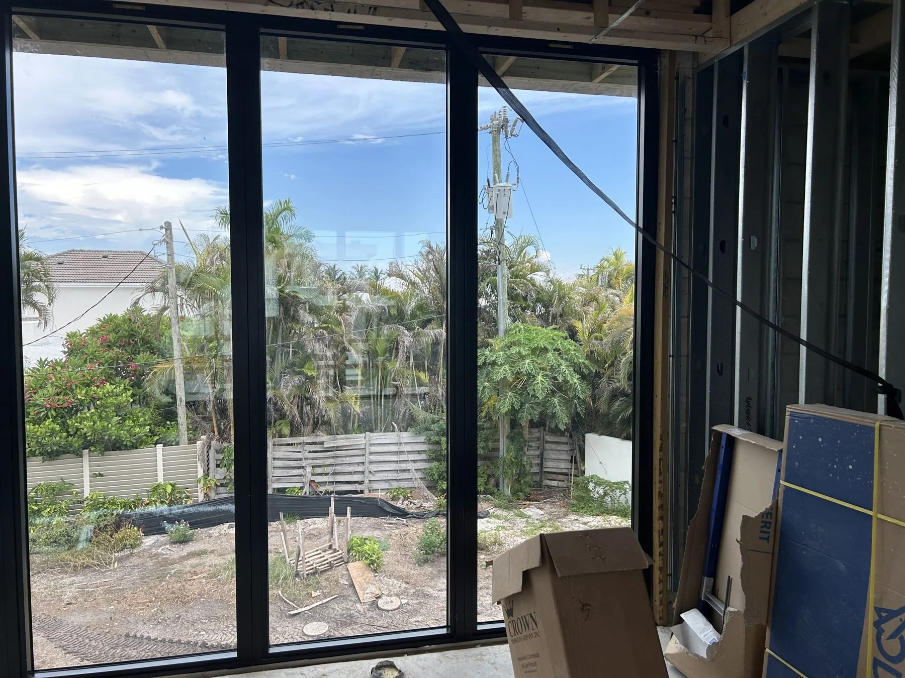 Bay Harbor interior view of impact windows overlooking landscaping