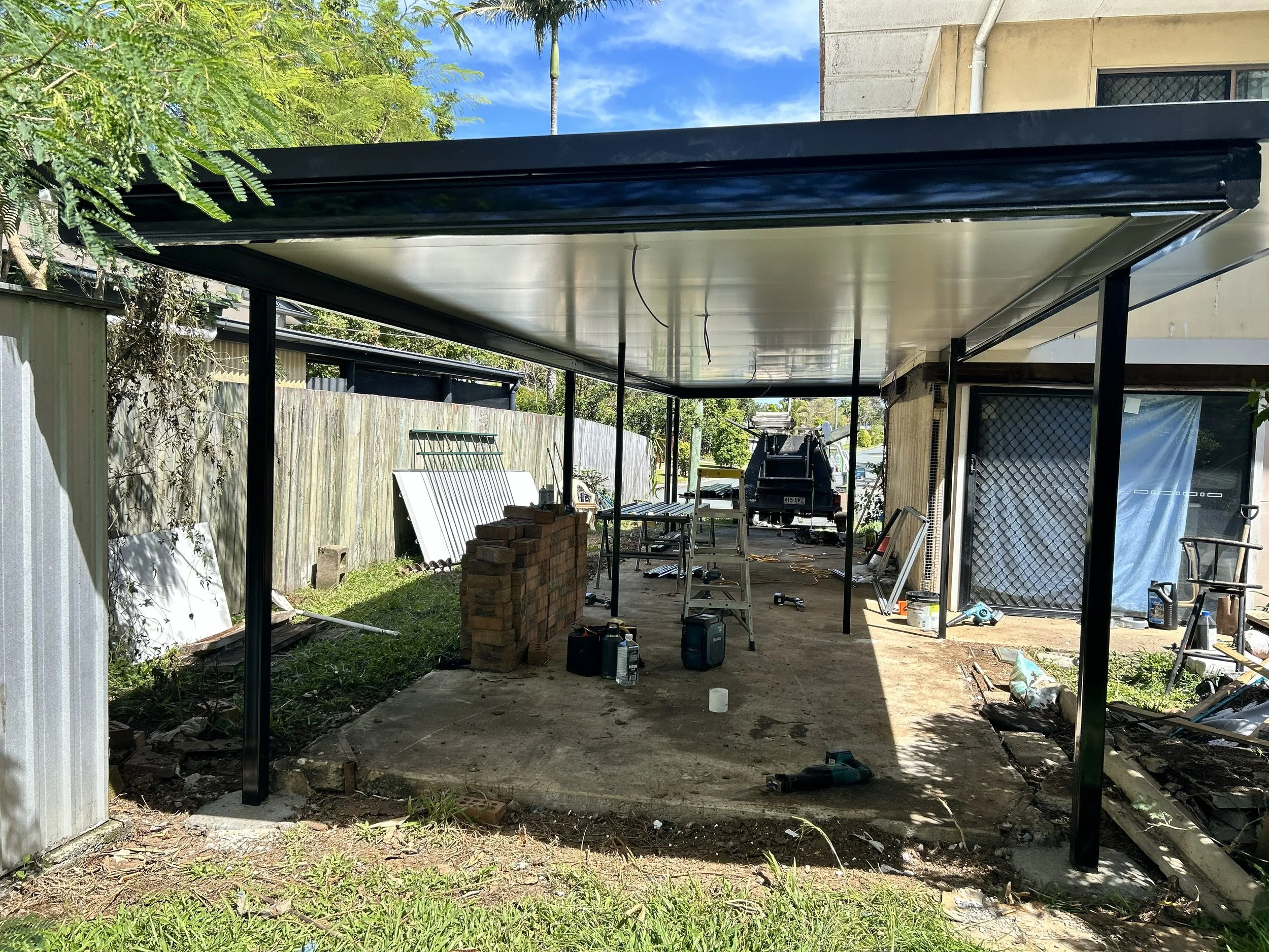 pull down old and install new wall attached patio at Logan