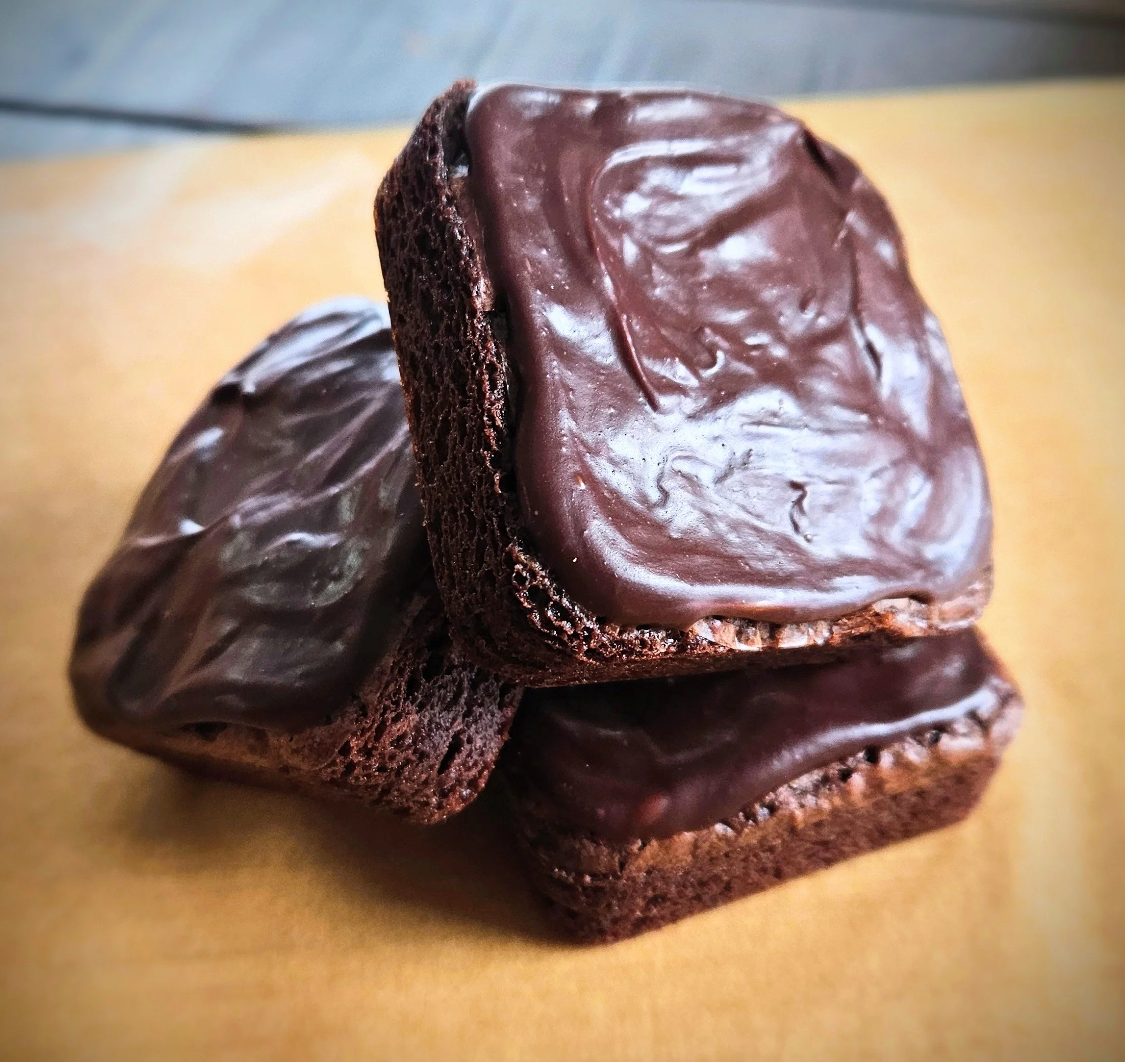 Fudgy homemade brownies topped with glossy dark chocolate ganache — Hauber Bread and Baking cottage bakery, Antioch Illinois