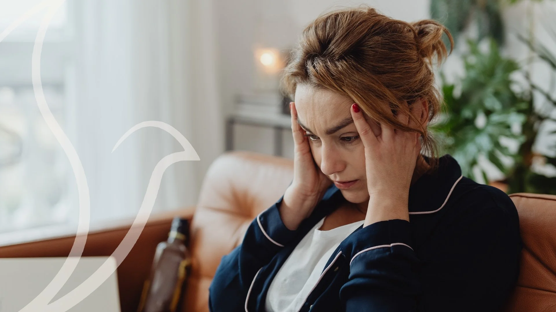 Overwhelmed woman in pajamas sitting on a couch holding her head, unable to quiet her racing thoughts – What to Do When Your Mind Won't Slow Down, A Brighter Beginning