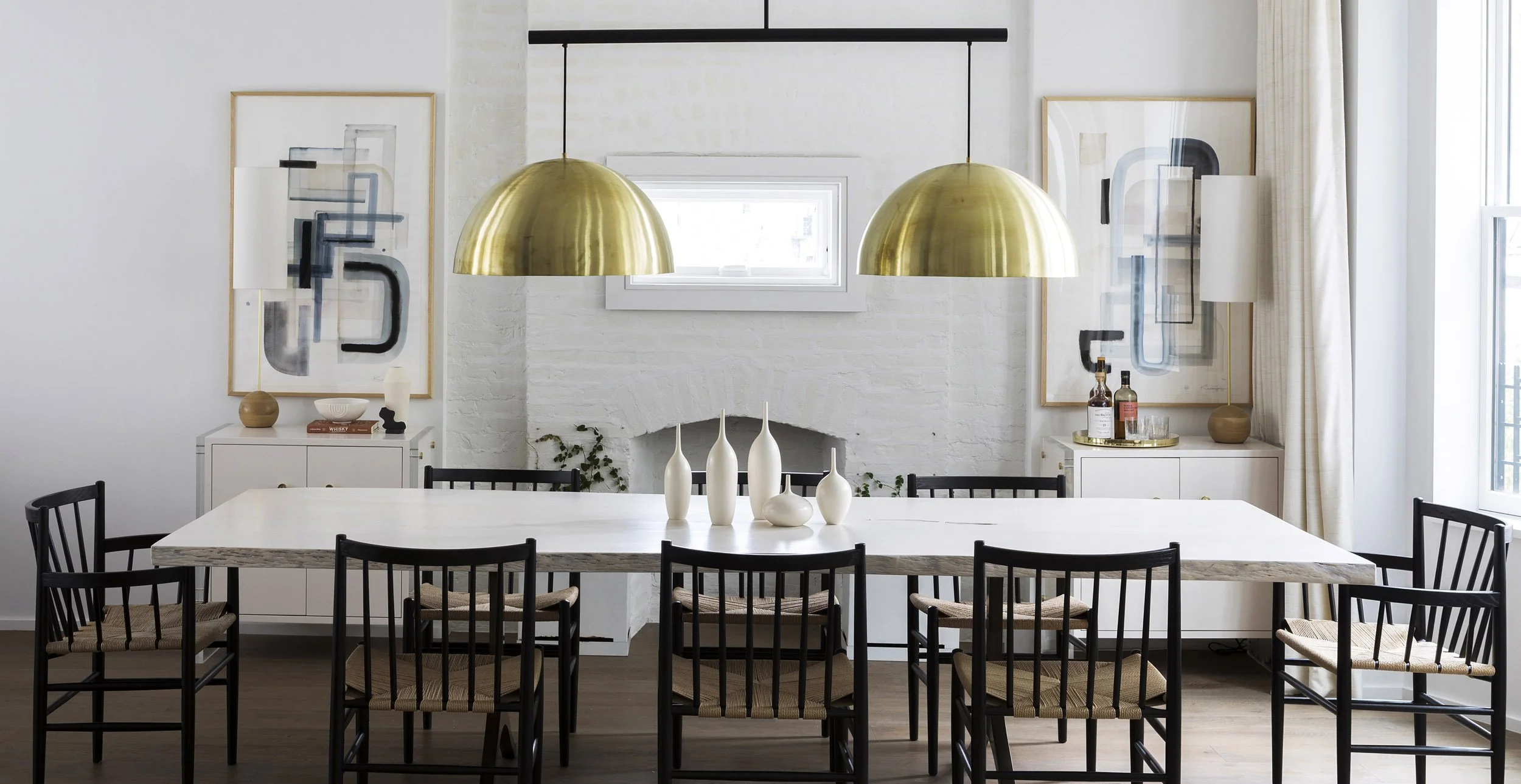 Studio Ness Dining Room with brass pendants expand-media