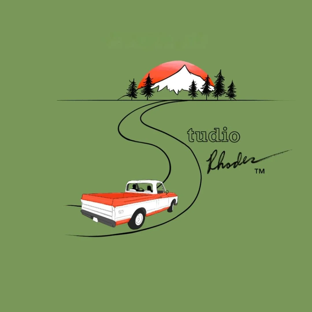 Illustration of a orange and white vintage truck driving toward a mountain with a sunrise and pine trees in the background, with the text 'Studio Rhodes" written in stylized font.