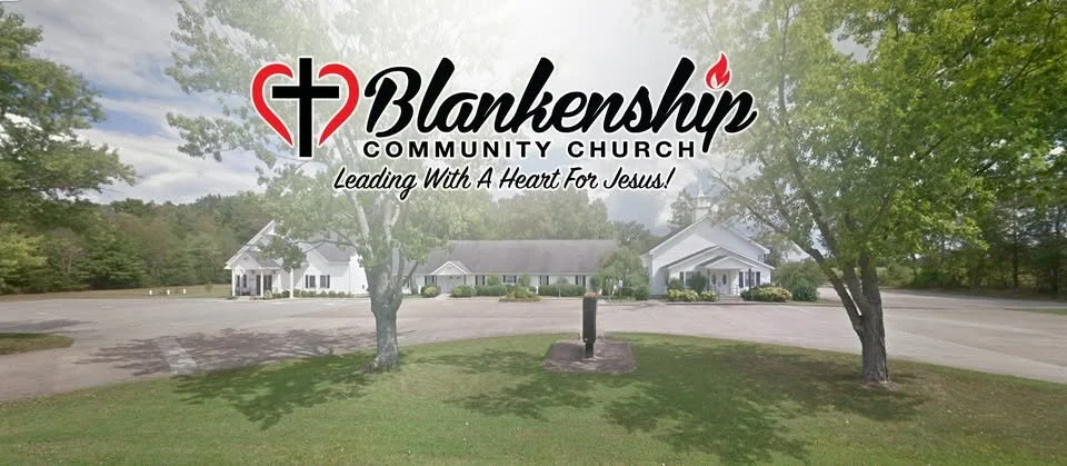 Sign for Blankenship Community Church with logo and tagline, surrounded by trees and parking lot.