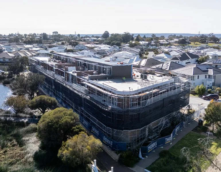 Pinnacle Planning - Cygnus Parade - Under Construction - Multi-story building under construction in a residential area