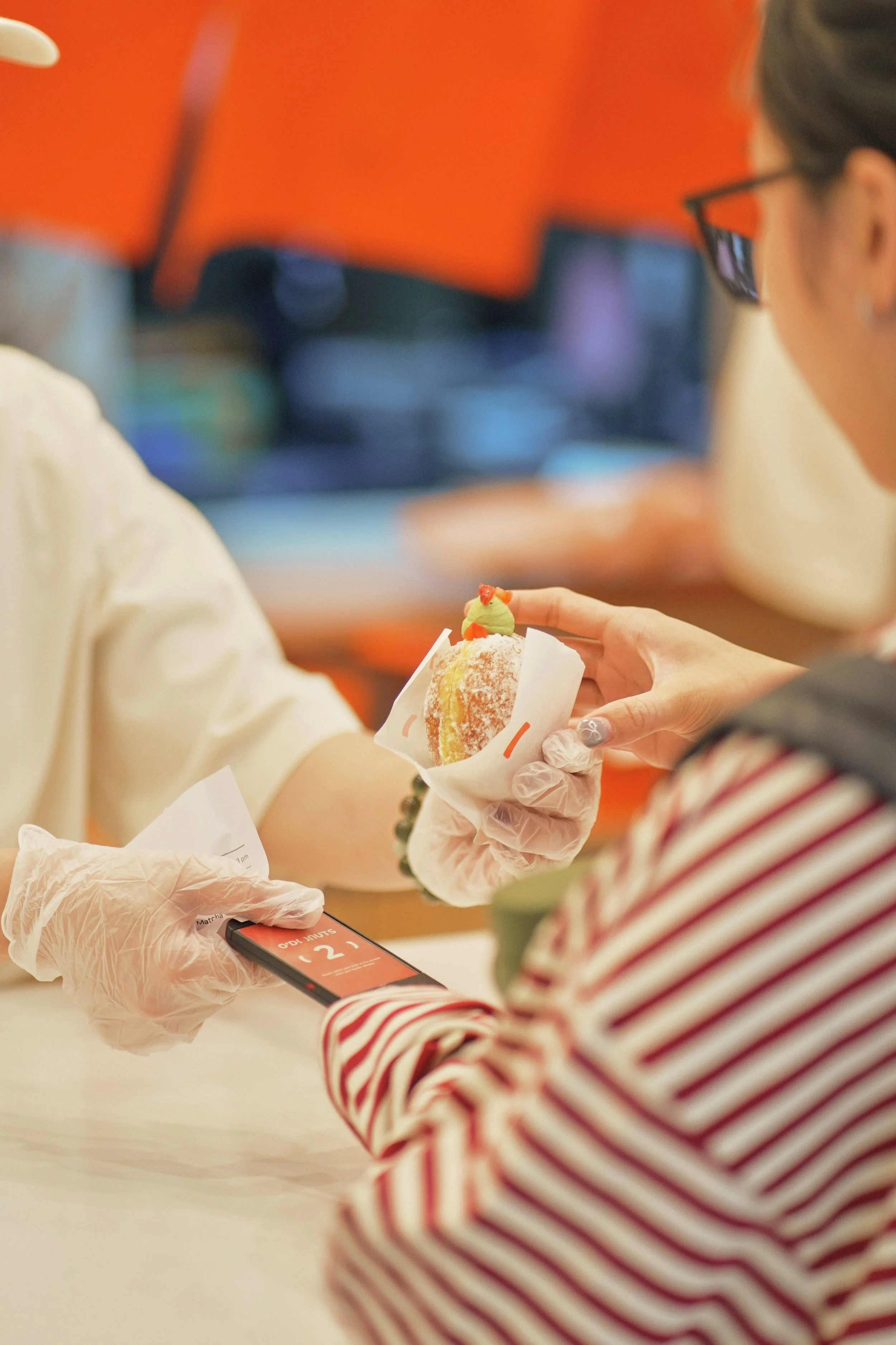 Staff serving customers and packing fresh Japanese nama donuts in store, ODonuts Chatswood Sydney