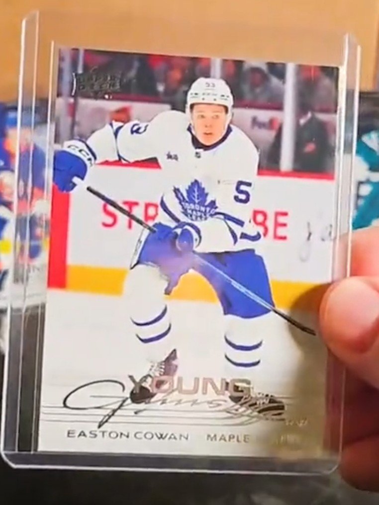 Hockey trading card depicting Easton Cowan of the Toronto Maple Leafs with his autograph.