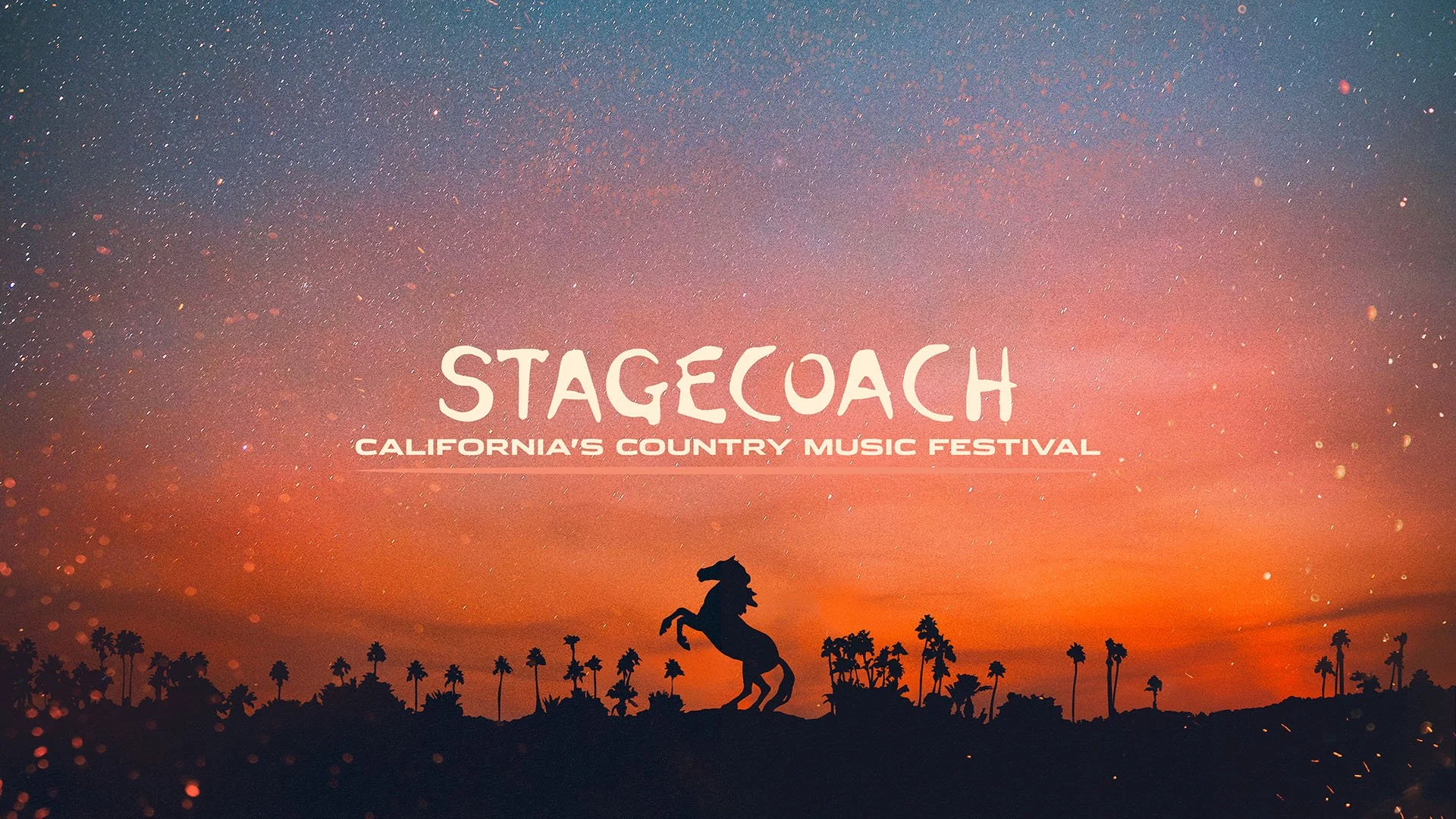 Silhouette of a rearing horse against a colorful sunset sky with palm trees, promoting Stagecoach California's country music festival.
