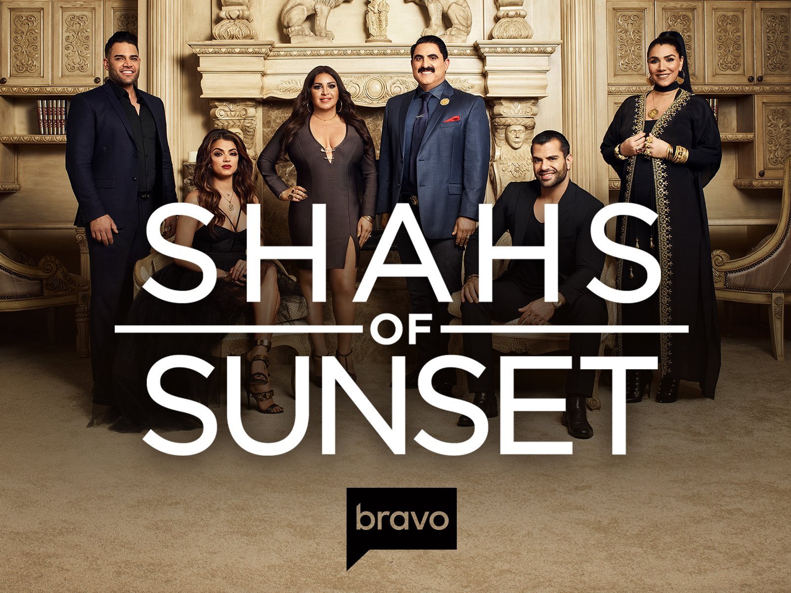 Group of seven adults dressed in formal attire posing in front of a fireplace and ornate decor, with the words "Shahs of Sunset" and the Bravo logo overlaying the image.