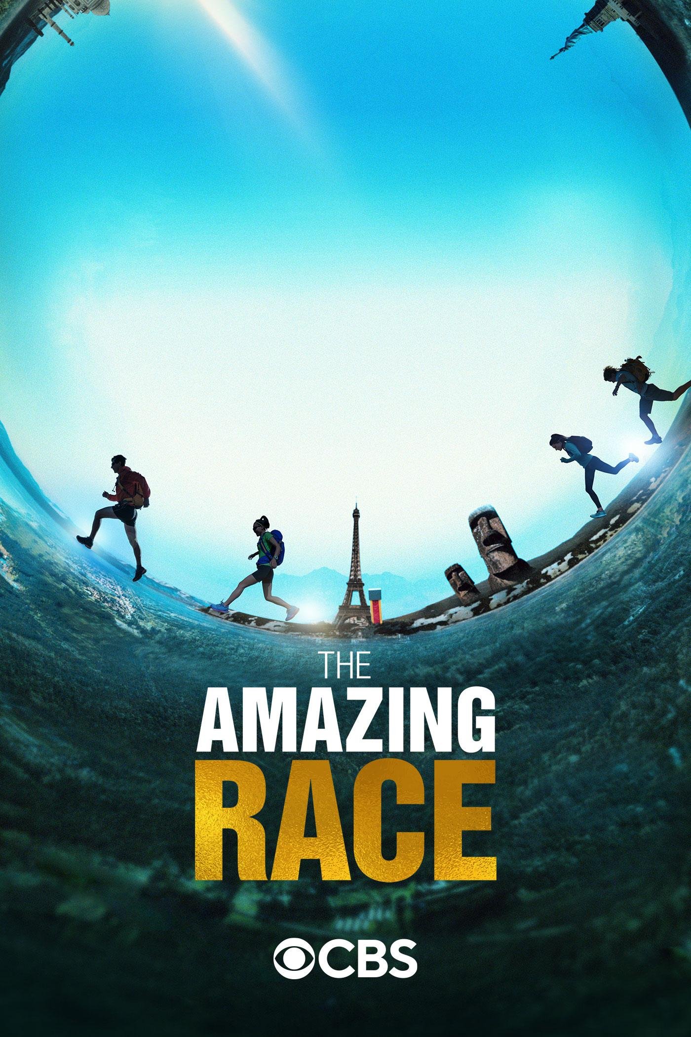 Promotional poster for 'The Amazing Race' TV show featuring an extreme fisheye perspective of tourists walking on the Eiffel Tower in Paris, with the title and CBS logo.