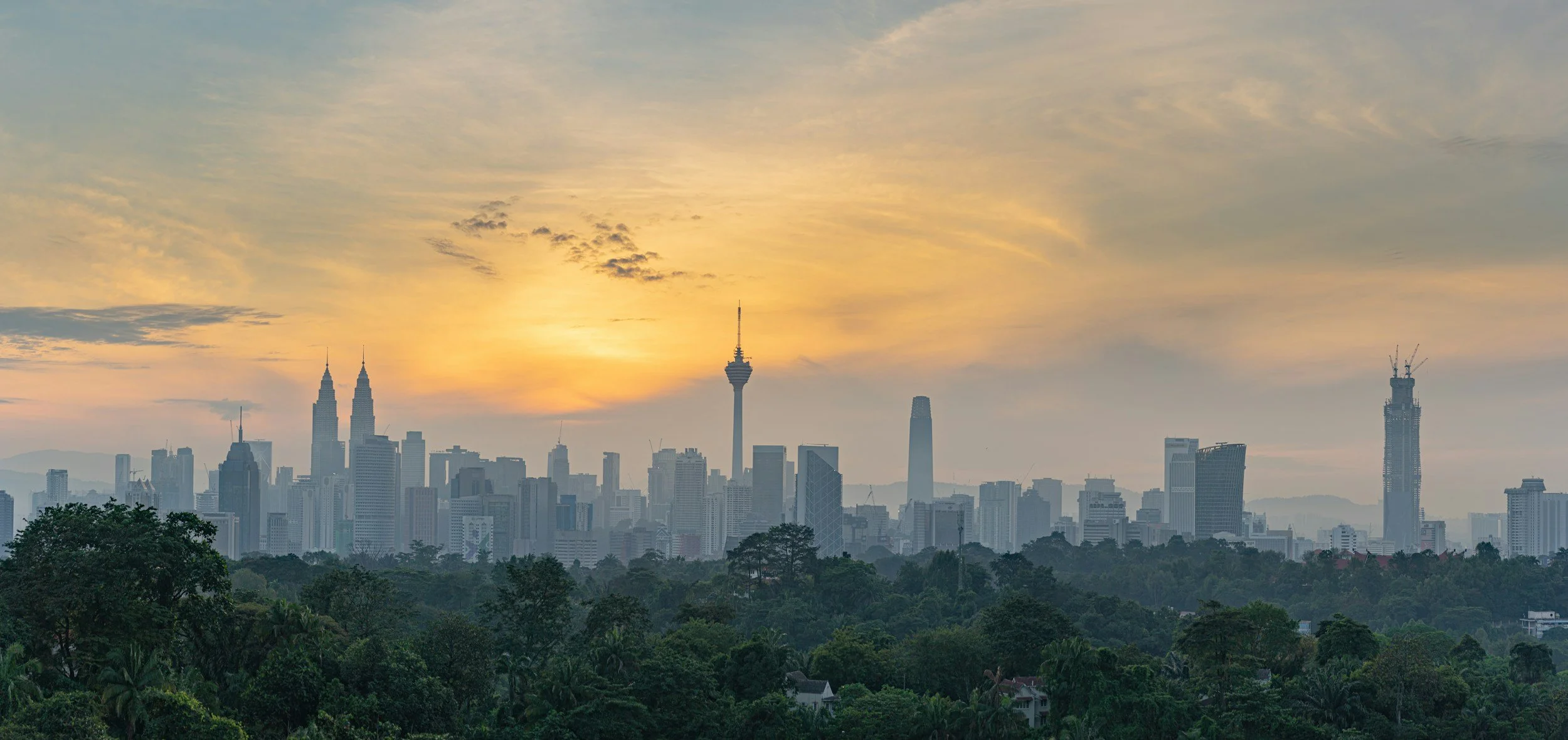 The sunset over the Kuala Lumpur skyline that you will be able to see and experience on your medical journey in Malaysia.