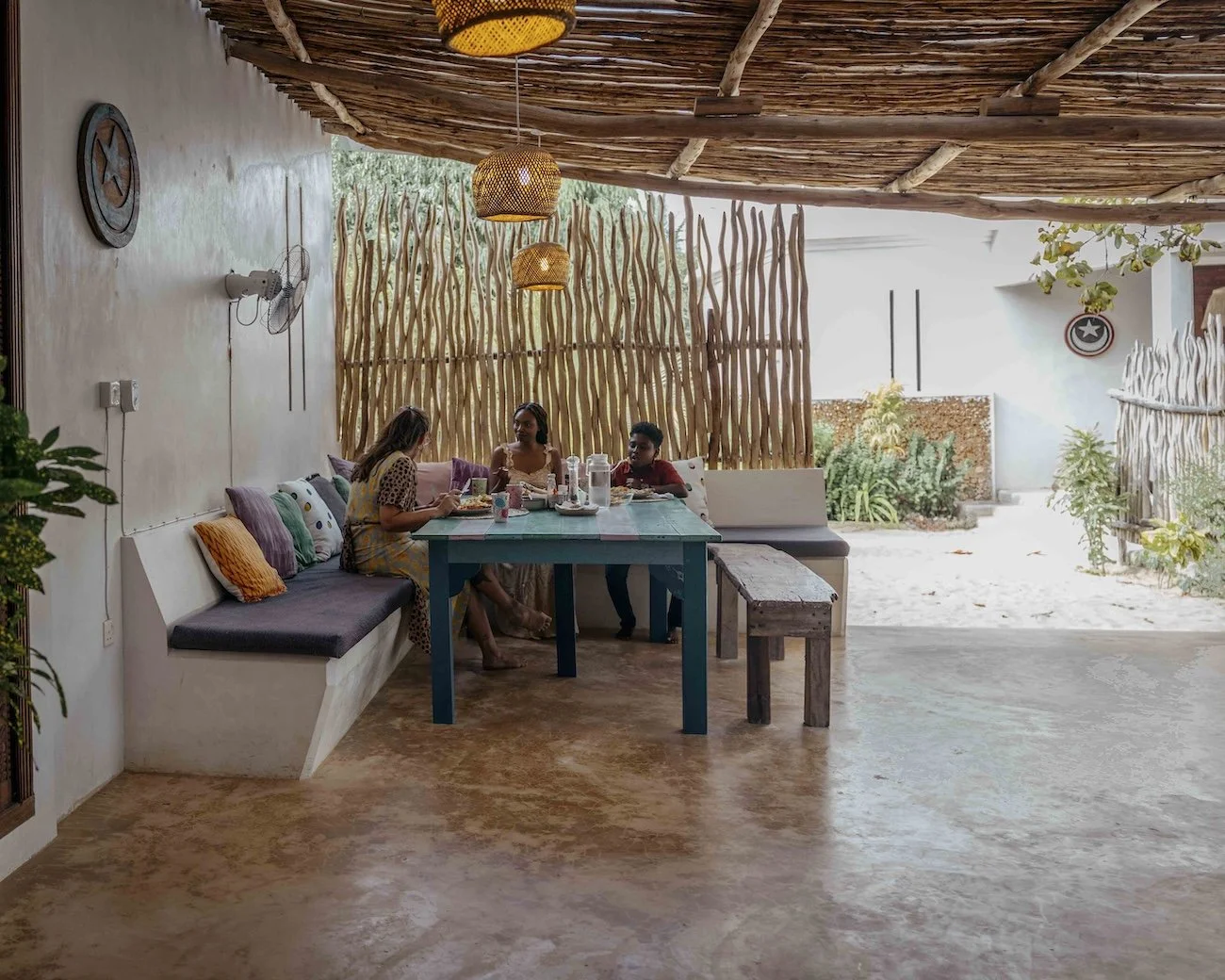 Guests enjoying lunch under the shaded dining area