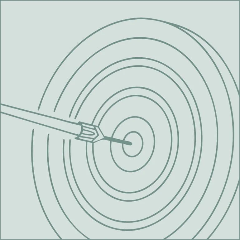 An arrow hitting the bullseye of a target with concentric circles.