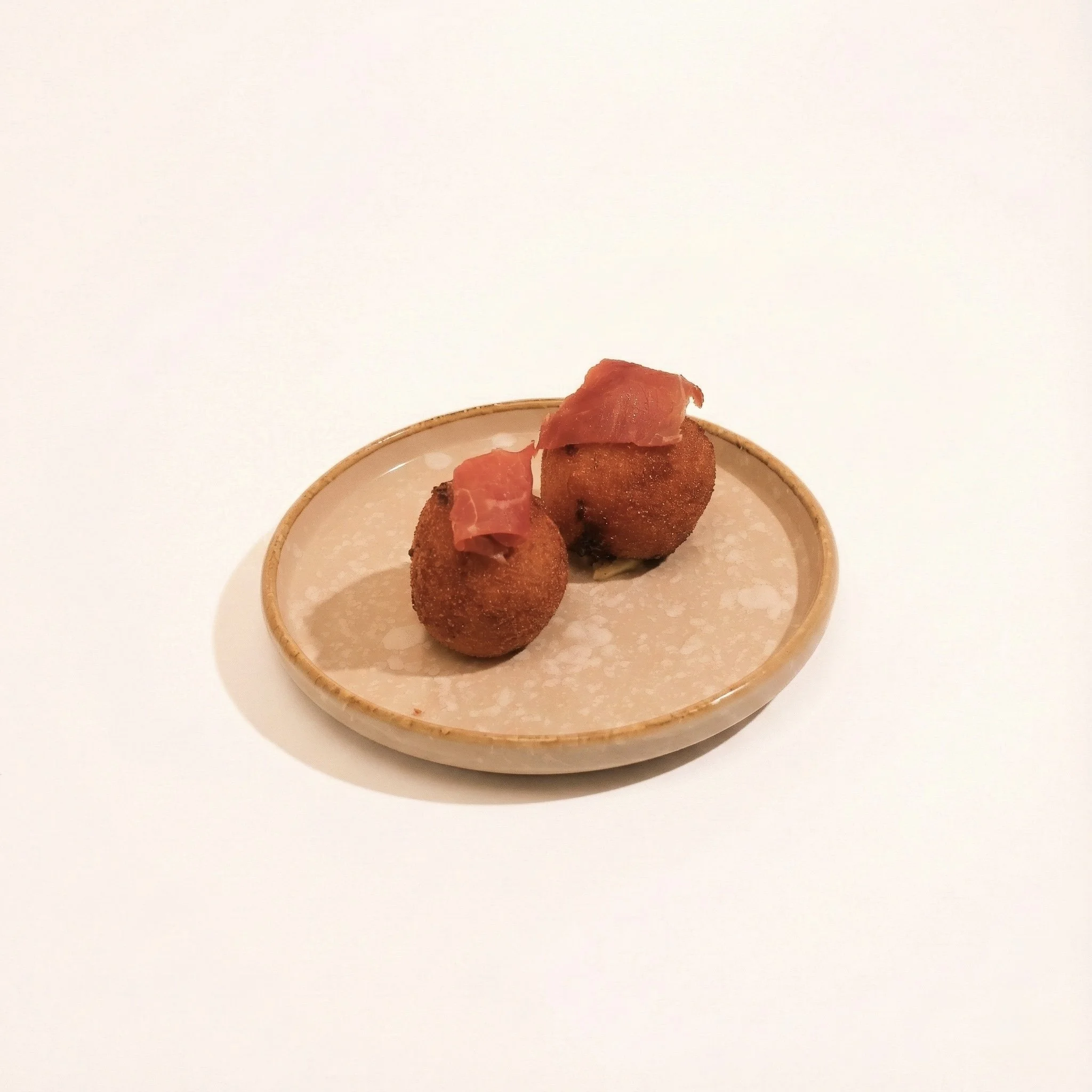JAMÓN & CHEESE CROQUETTES · Crisped croquette filled with jamón and melted cheese · 65 / piece